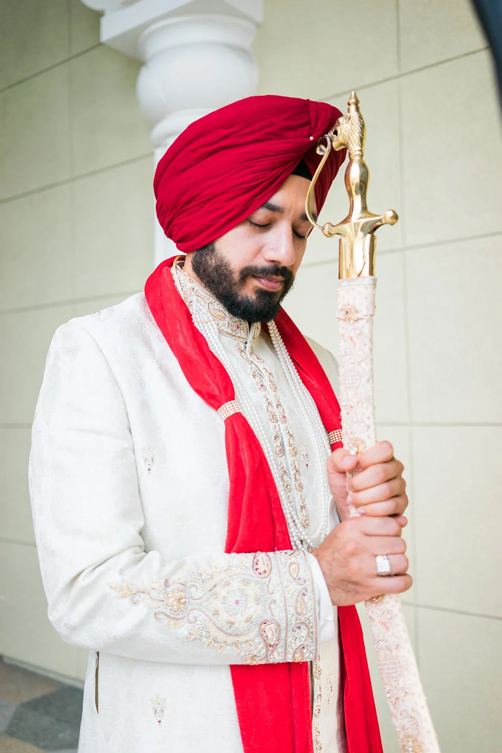 Sikh groom holding the sword