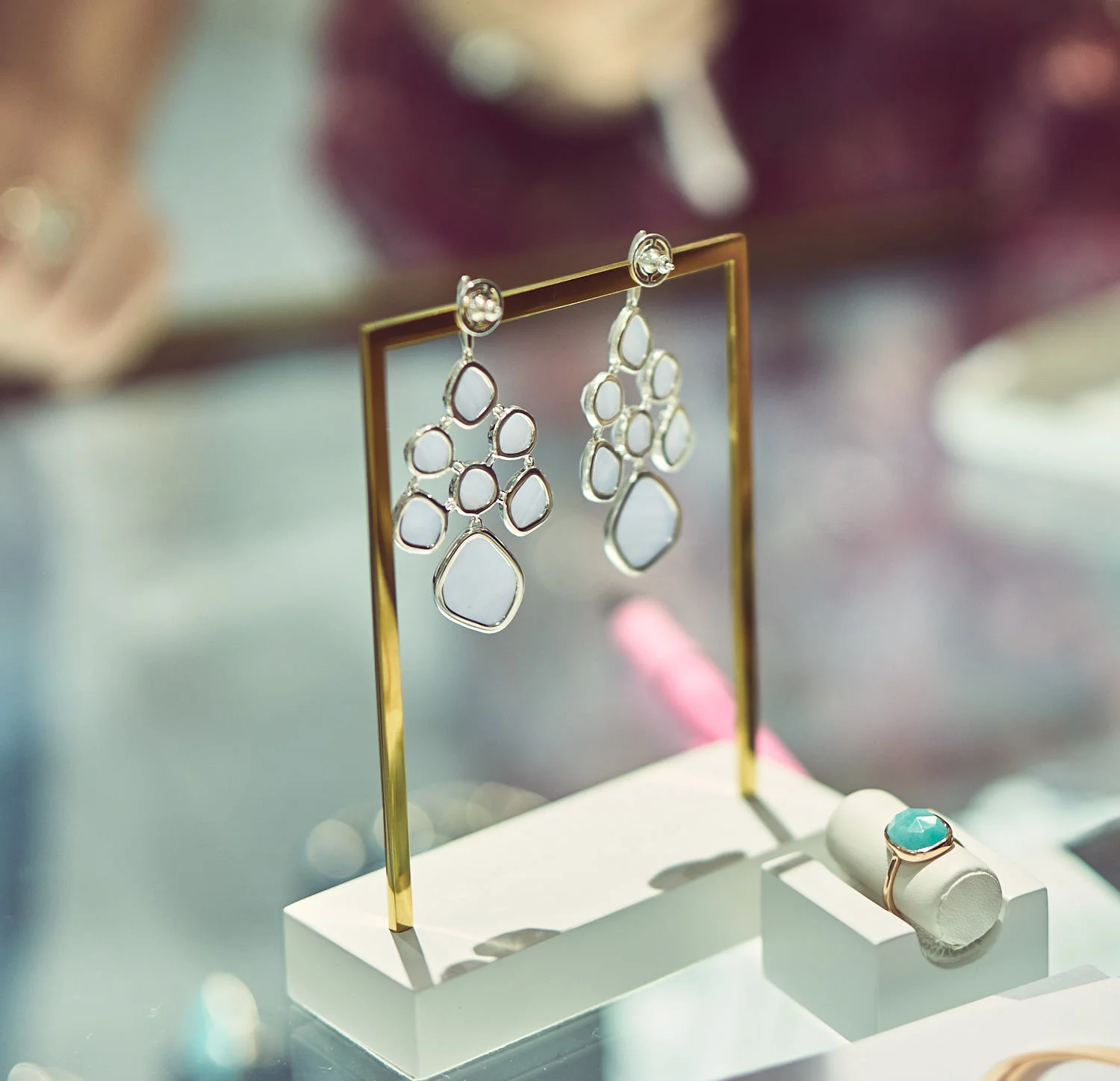 Monica's signature earrings on display.