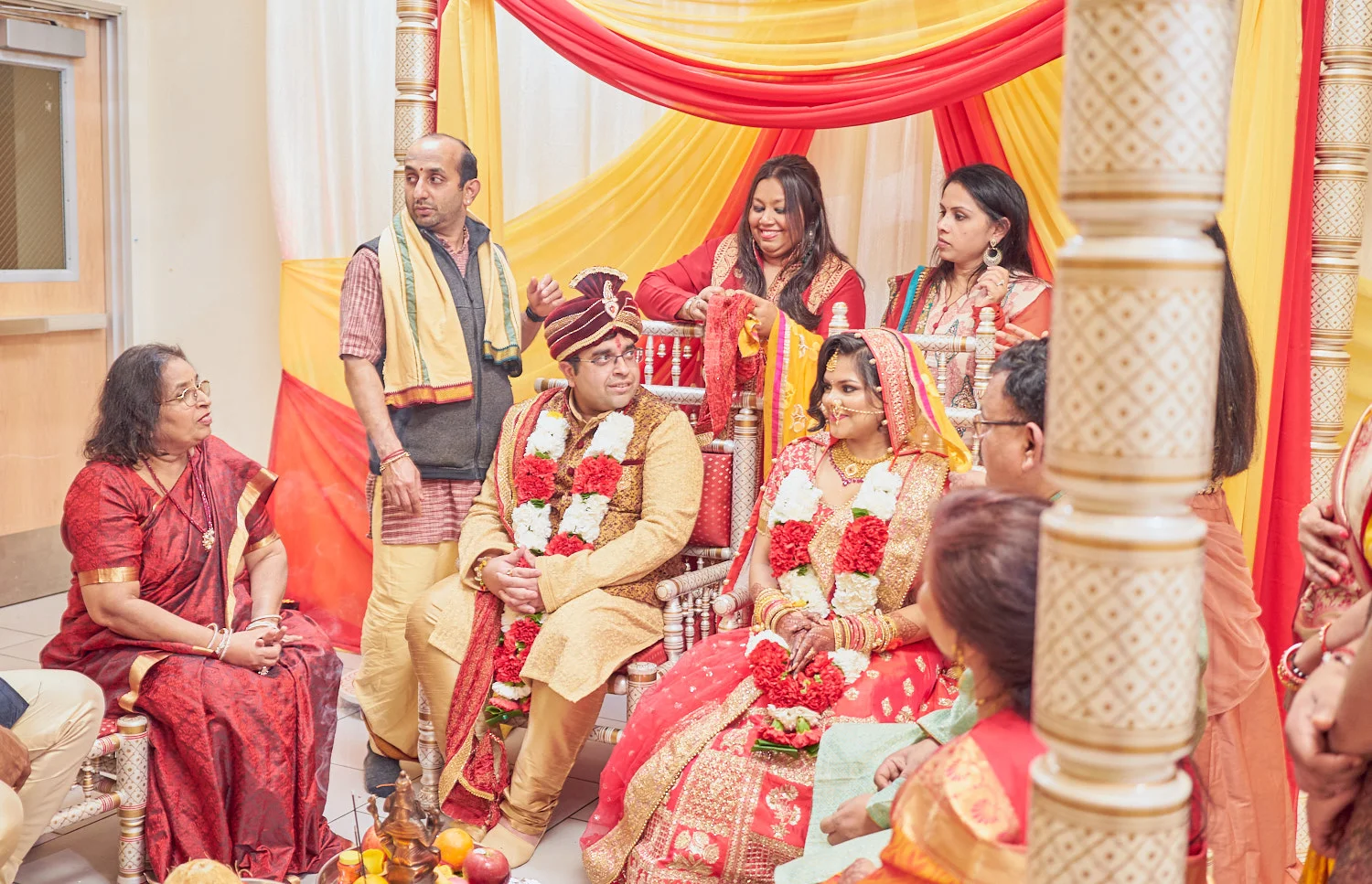Friends & family helping the couple tTying the knot literally