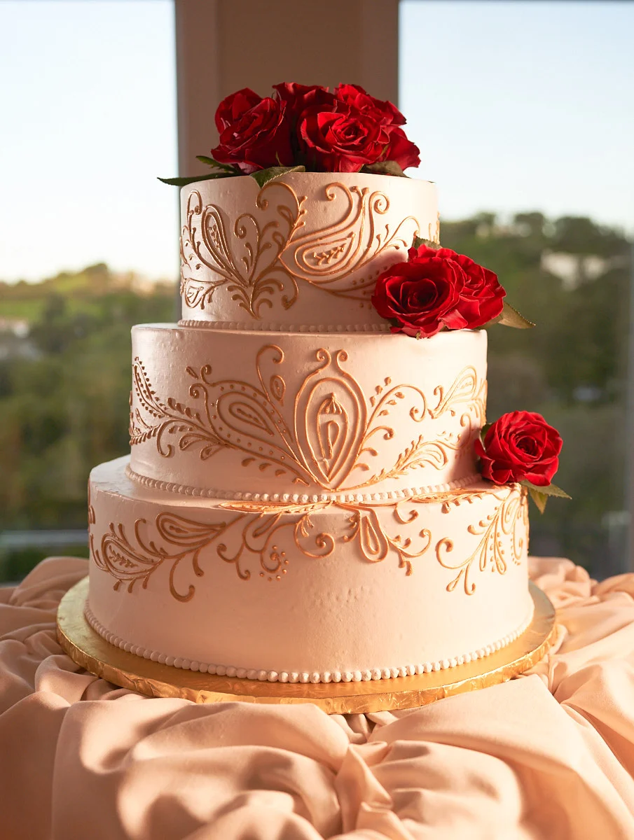 The three tier wedding cake shot using split lighting with magmod modifiers just before the reception.