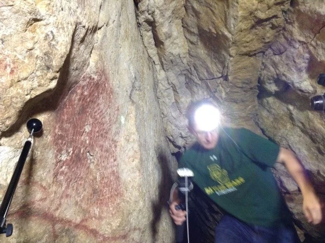 Ben Altshuler Positions the flash in a tricky bit of the caves.