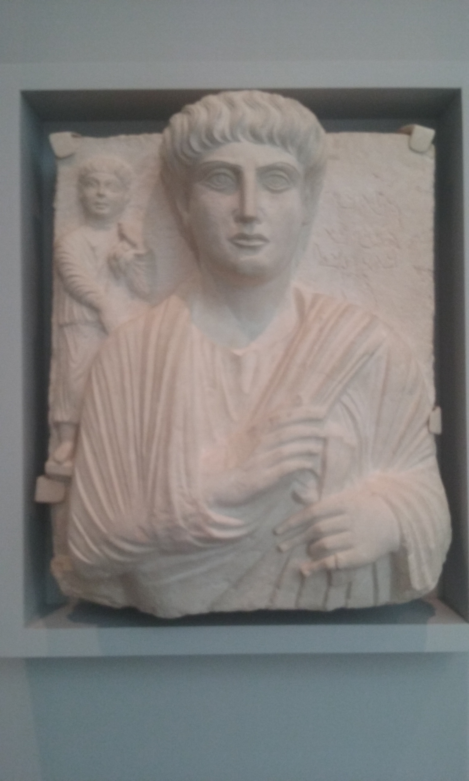 Relief of a Man and Child, wearing both Greco-Roman and Parthian style clothing