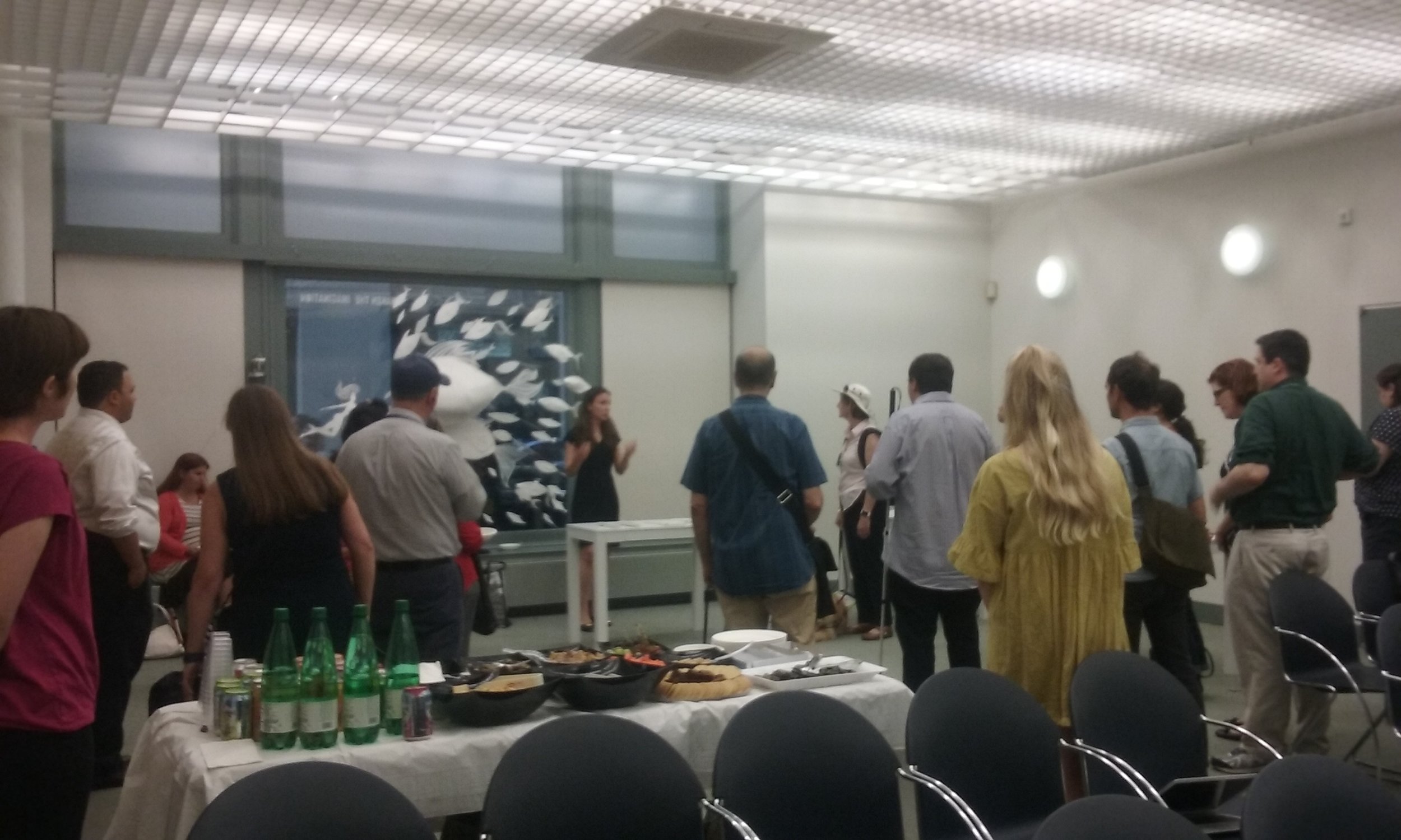 Dr. Alexy Karenowska describes the tactile exhibition at its opening at the NYPL Andrew Heiskell Braille and Talking Books Library