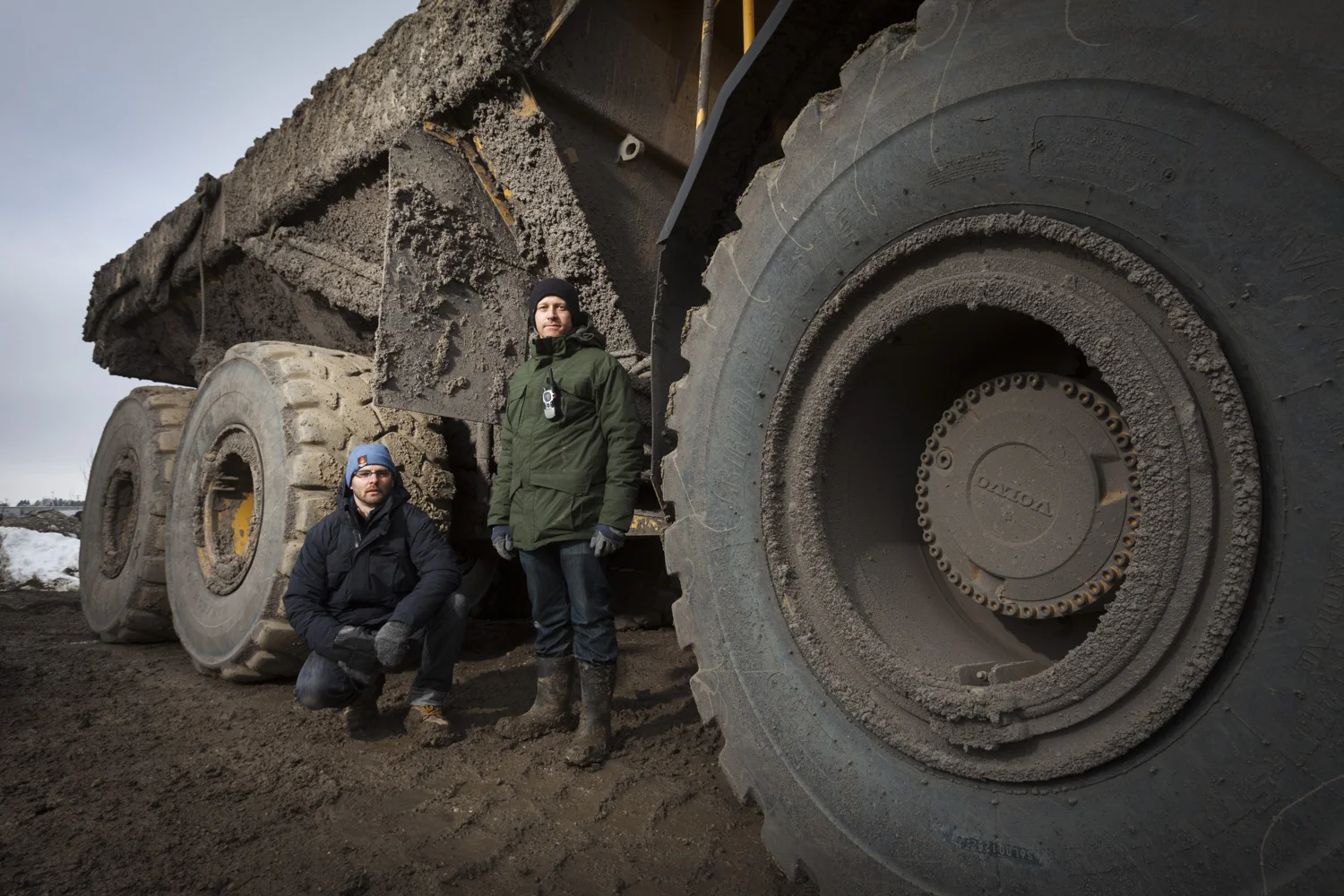 With a filthy truck towering over Aaron and I, you can get a sense of the scale of these massive machines.
