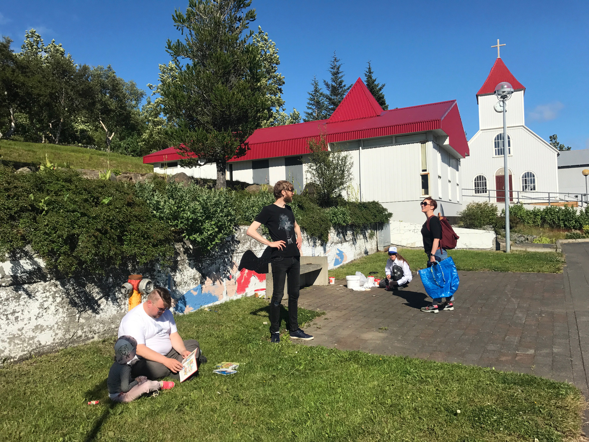 Sigga Björg works on her mural with company from Clara, Hákon, Mikael, and Megan.