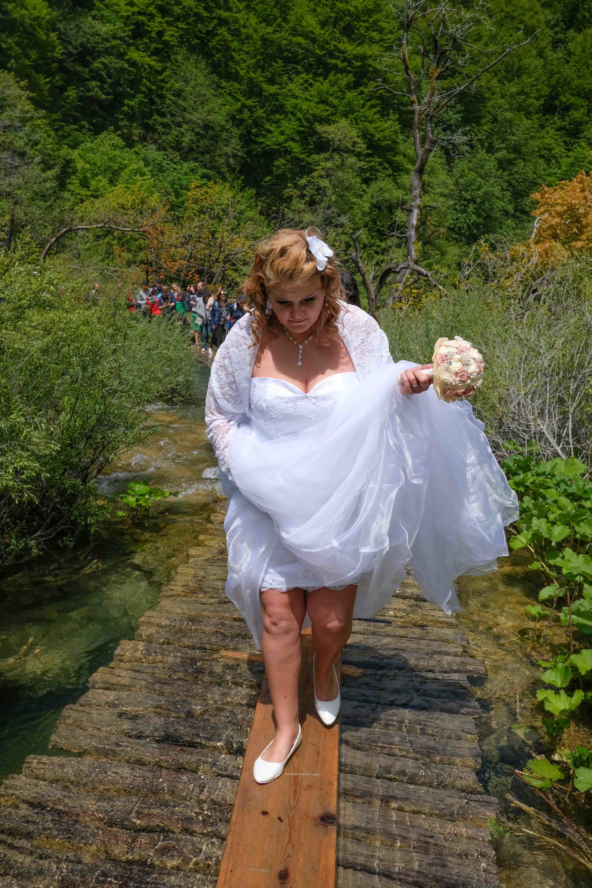 Another choice in wedding venue! heavy rains submerged the boardwalk through the waterfalls at Plitvice lakes Park. Crowds lined up to navigate single file across the flooded area.