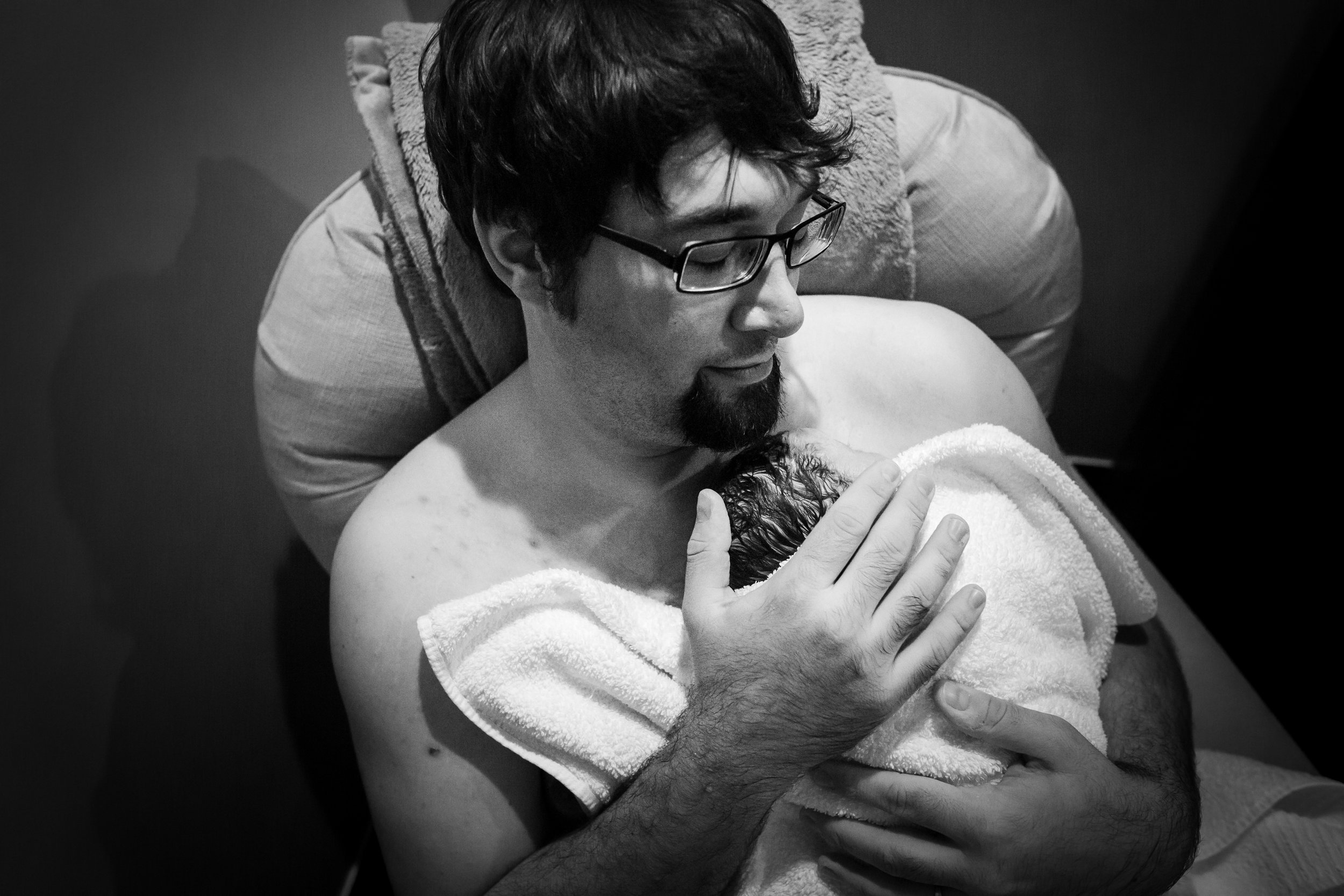 Dad Holds Newborn Bloomington, IL