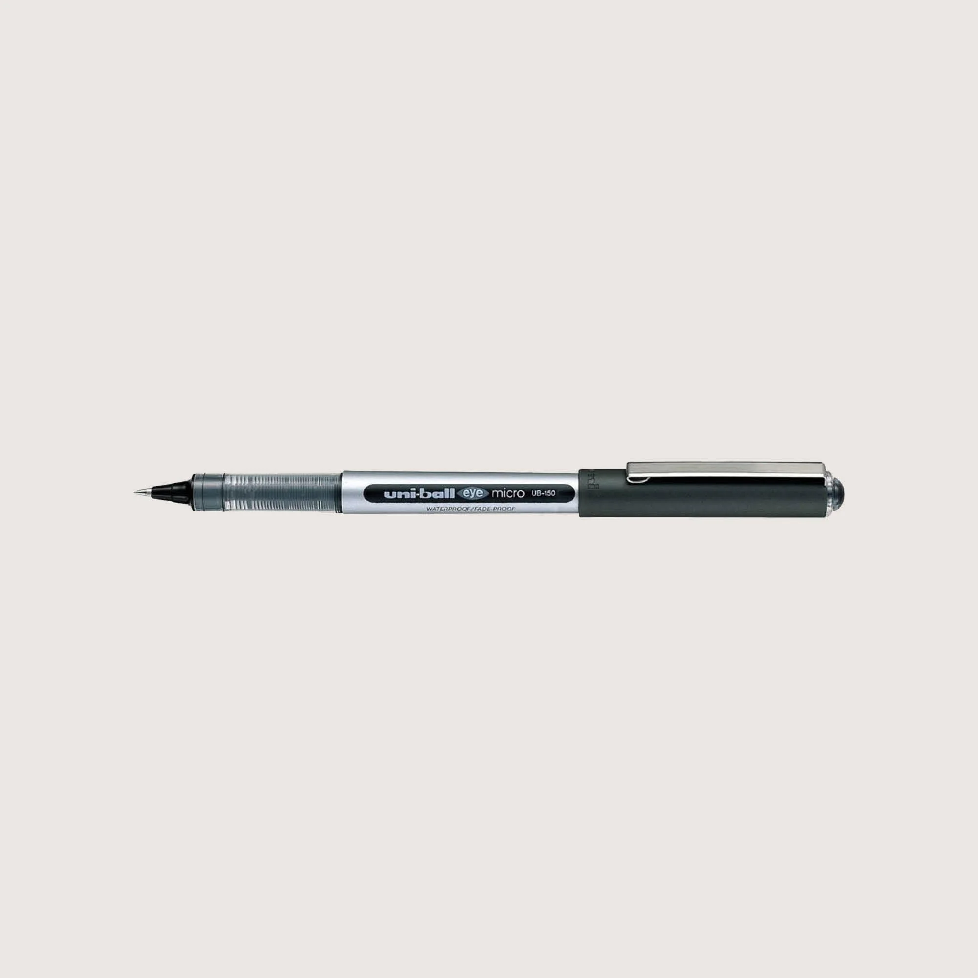 A silver and black Uni-Ball micro pen lying horizontal on a white background.