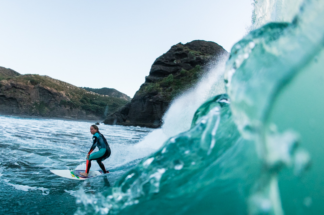 One of the aforementioned Bar locals with the Piha Bar Barrel image on her living room wall; team Te Ahu Boardrider Stephanie