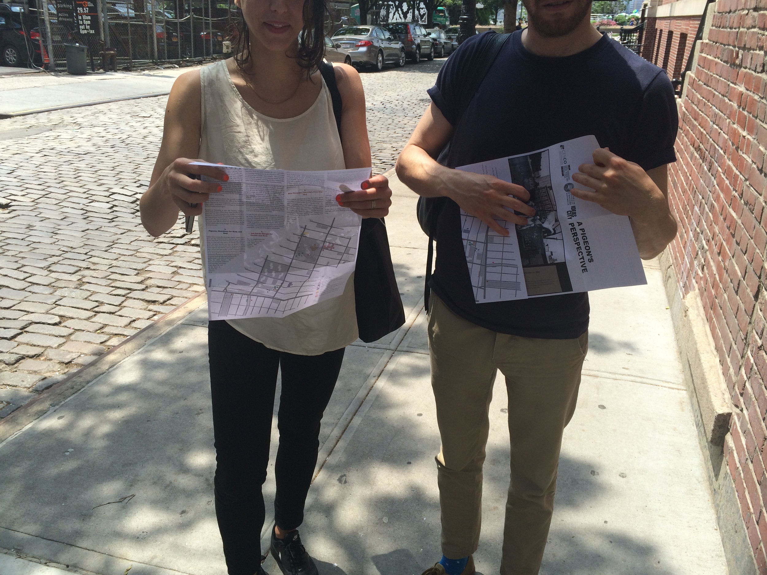  Participants of the walk holding the accompanying maps. 