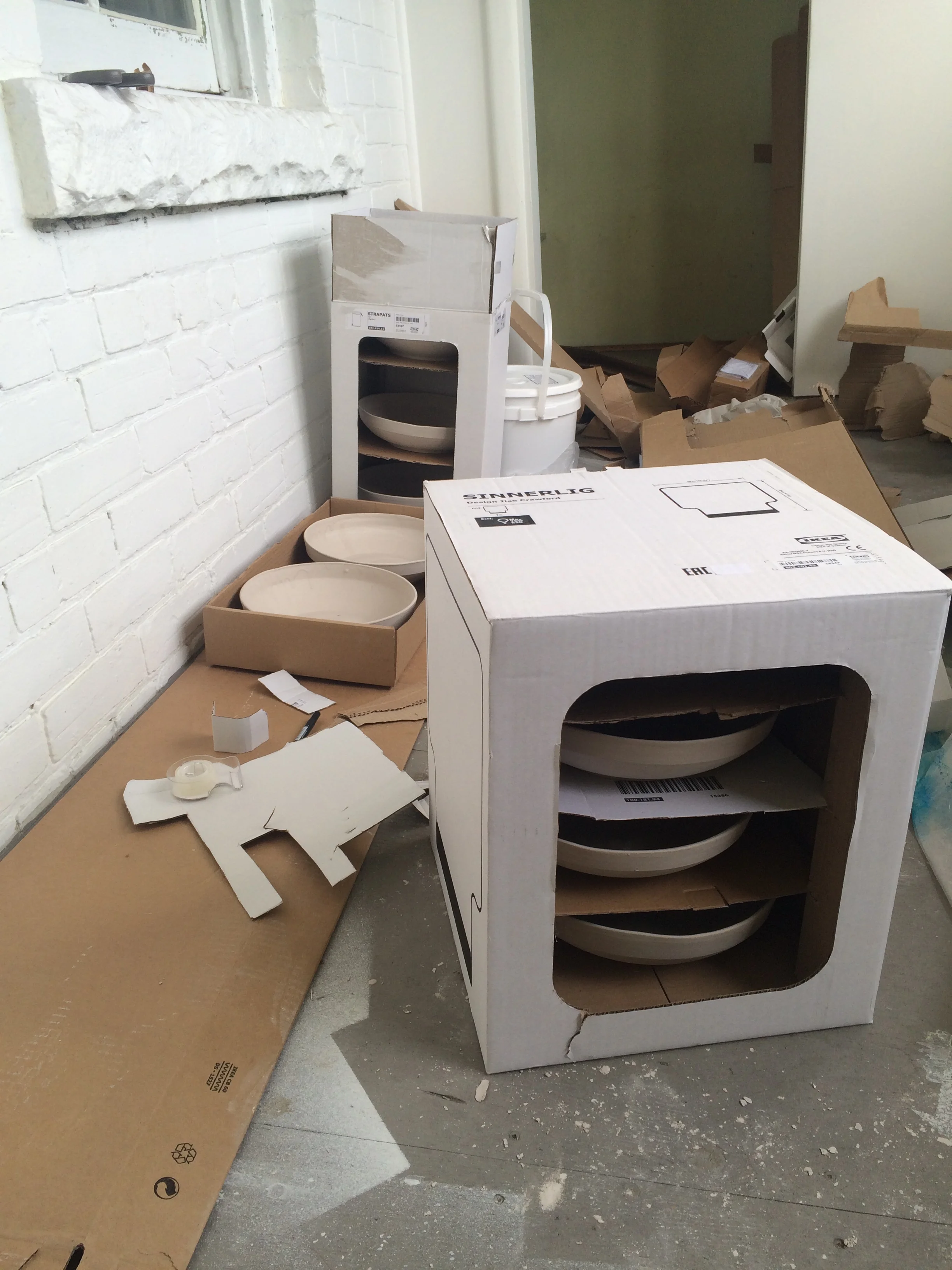Transporting the bowls to the kiln.