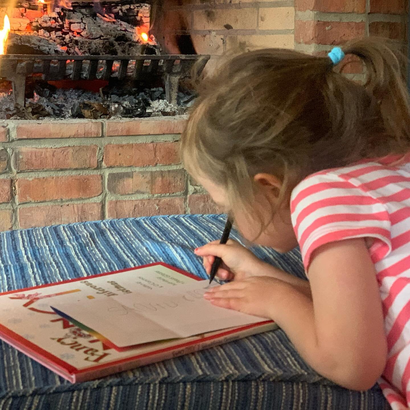 Writing her letter to Santu Cloz. Asking for a toy unicorn, a little toy kitchen for her dolls, a baby doll with a swim suit on you can take on and off and a little toy fire. Oh and a toy shark and sparkle shoes for Kinney.  Oh Ho Ho Ho Mere Crismis 