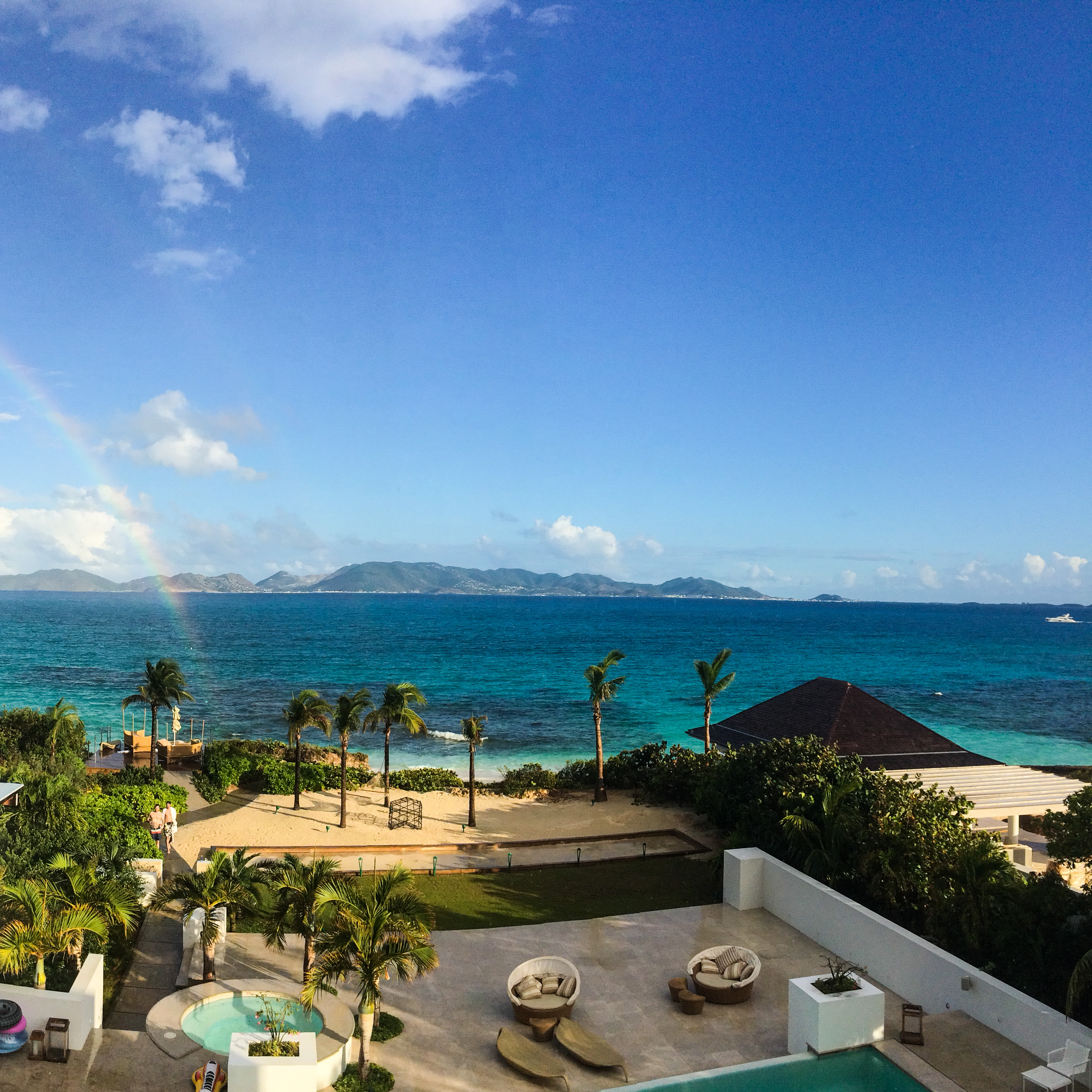 A rainbow with St. Martin in the distance taken at the Villas at CuisinArt with the men returning from an afternoon swim. 