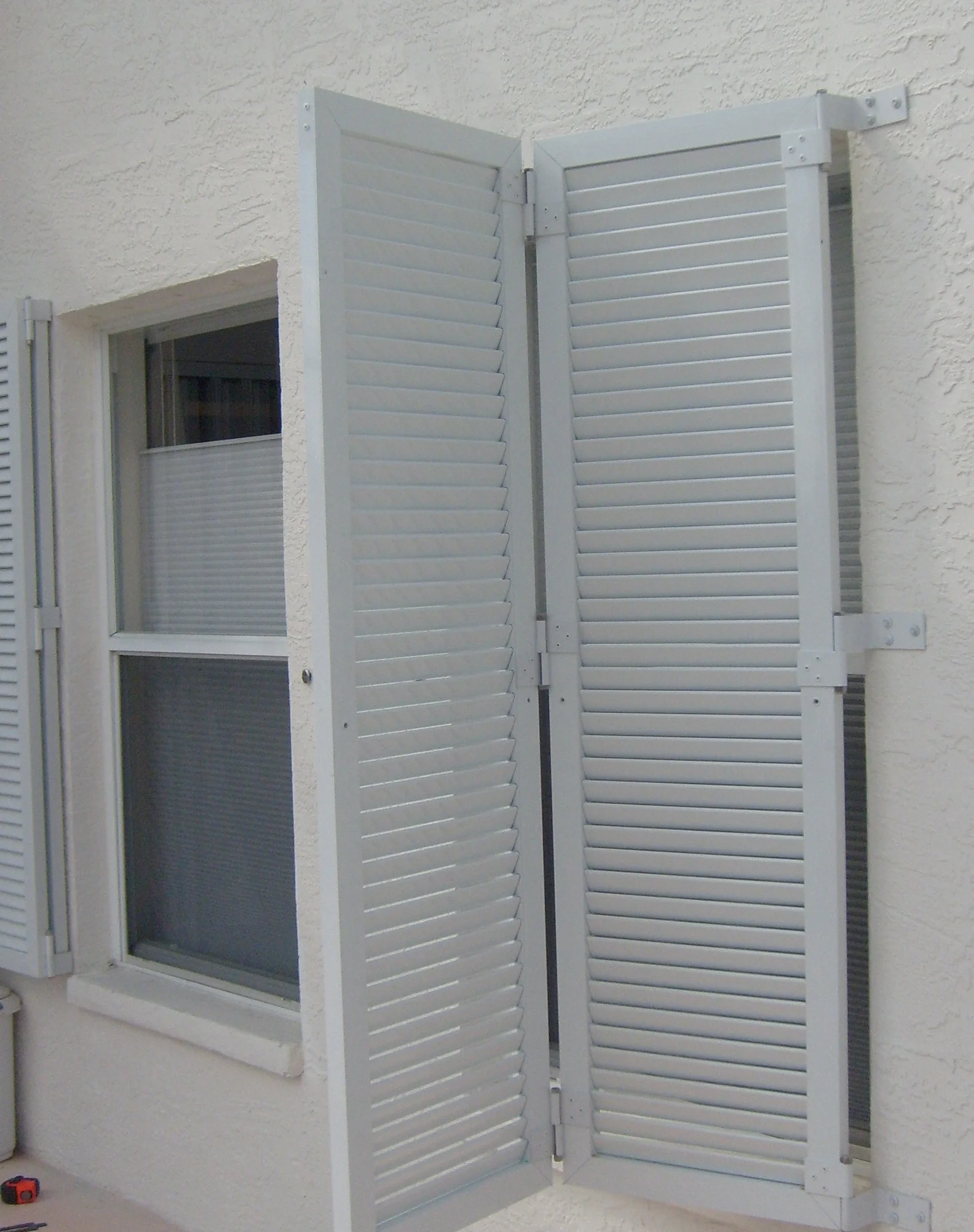 Colonial jansen shutters windows hurricane window protection