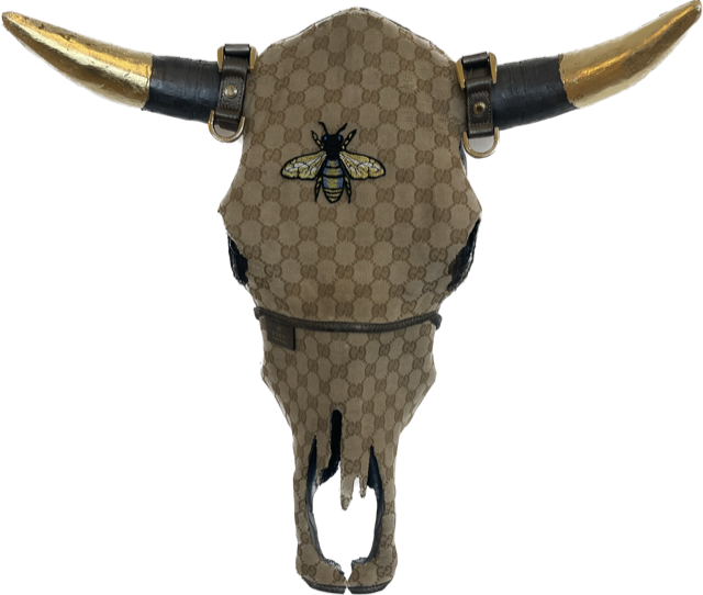 Gucci | Repurposed Gucci fabric and accessories, gold  leaf, acrylic on steer skull | 19 x 19 x 7 inch |  $1,800