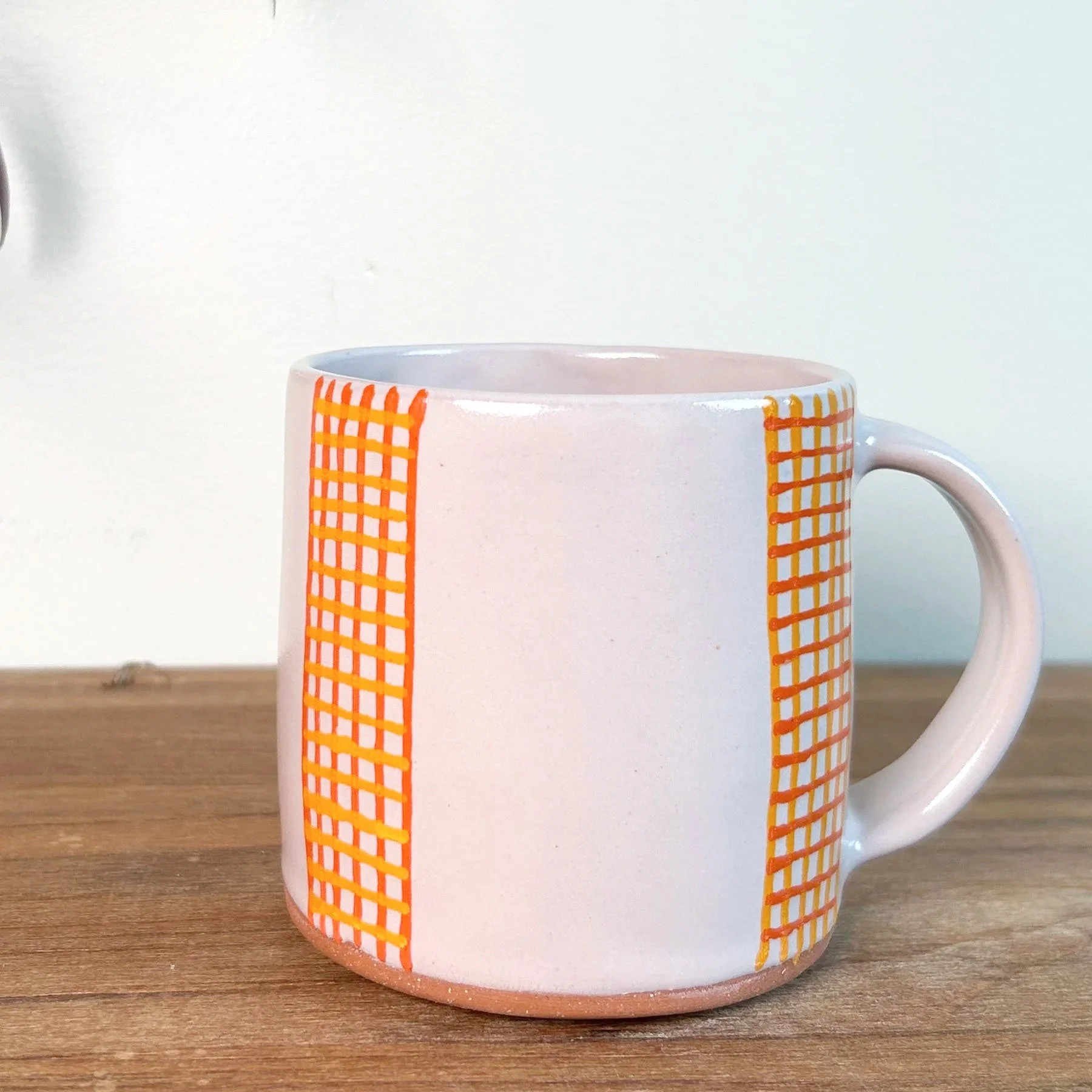 whitemugwithorangecrosshatch.jpg