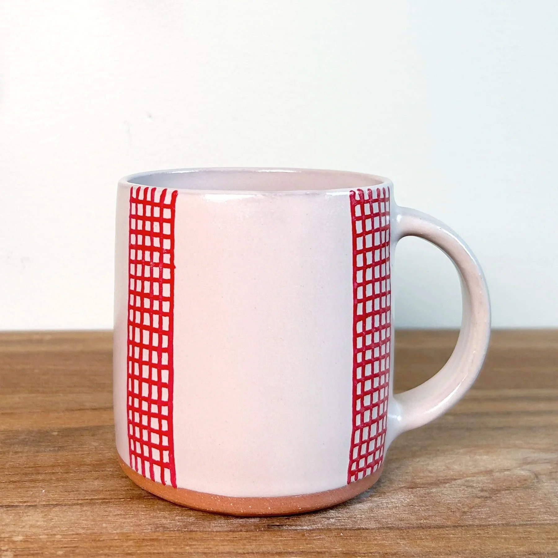 whitemugwithredgrid.jpg
