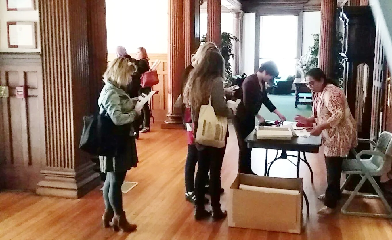 Participants sign-in for the Conference and Festival at the Hamilton Club