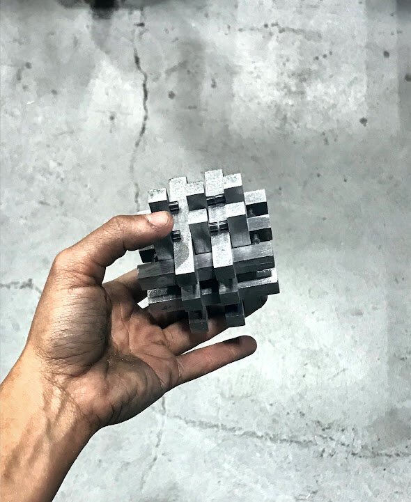  Steel joinery puzzle consisting of 18 interlocking pieces   