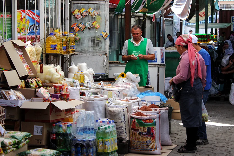 Shopkeepers at a stall at Dordoy Bazaar