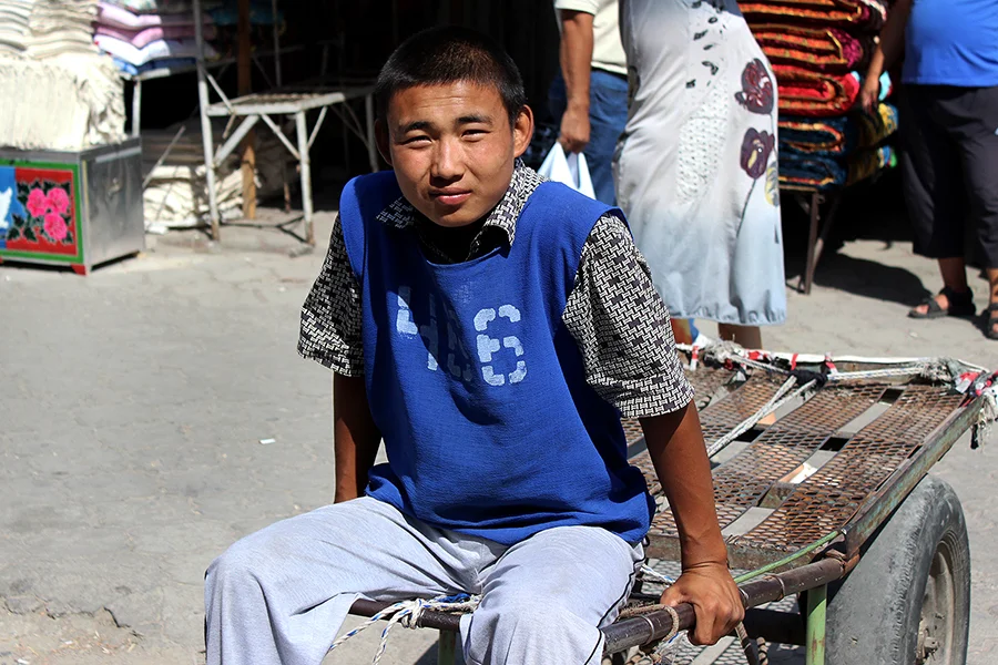 boy waiting on his cart in Dordoy Bazaar