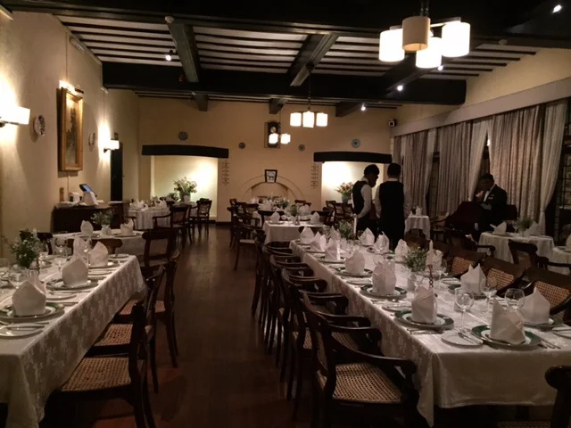 The tables set for dinner in the Hill Club's dining room. (Picture taken before the lights were dimmed and the candles lit.)