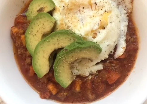Sweet potato & beef chili with fried egg and avocado