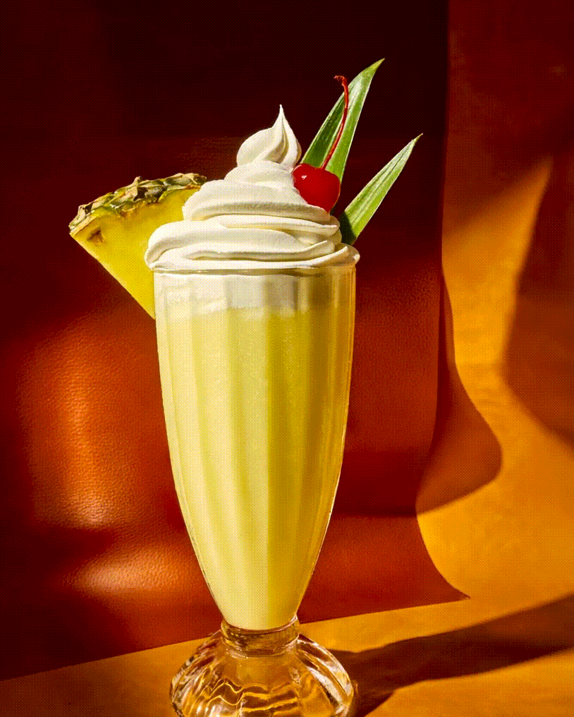 Gen-4-Turbo-A-luxury-tropical-pineapple-milkshake-in-a-glass_-shot-in-a-warm-sunlit-environment-p-3.gif