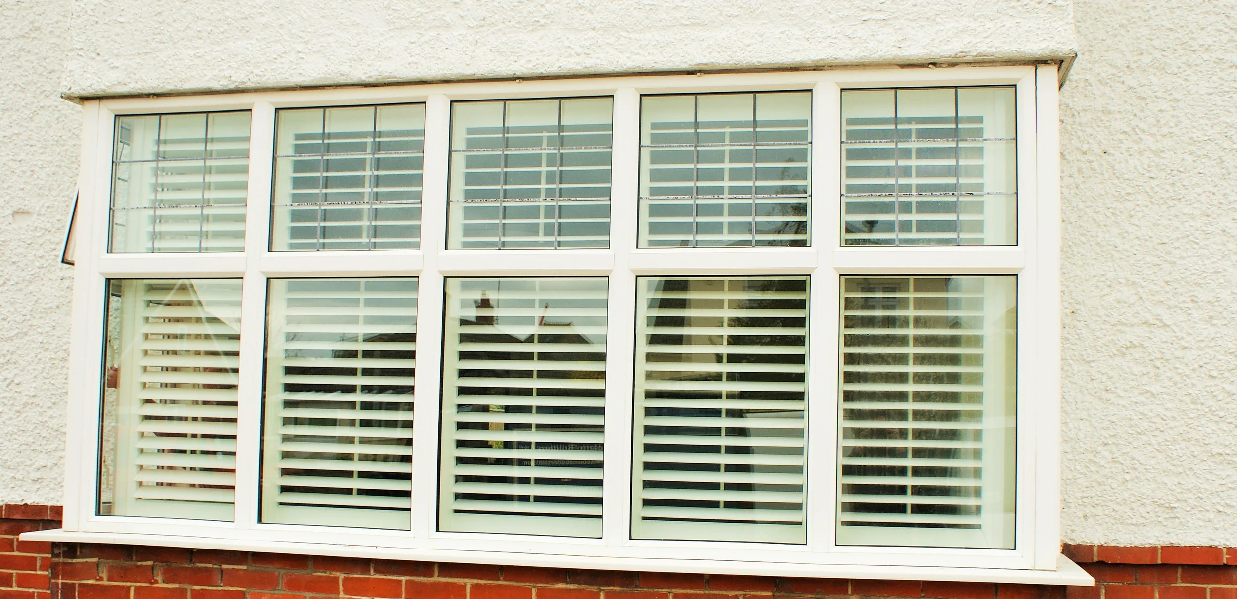 exterior-view-square-bay-window-shutters-christchurch-dorset-£1475.JPG