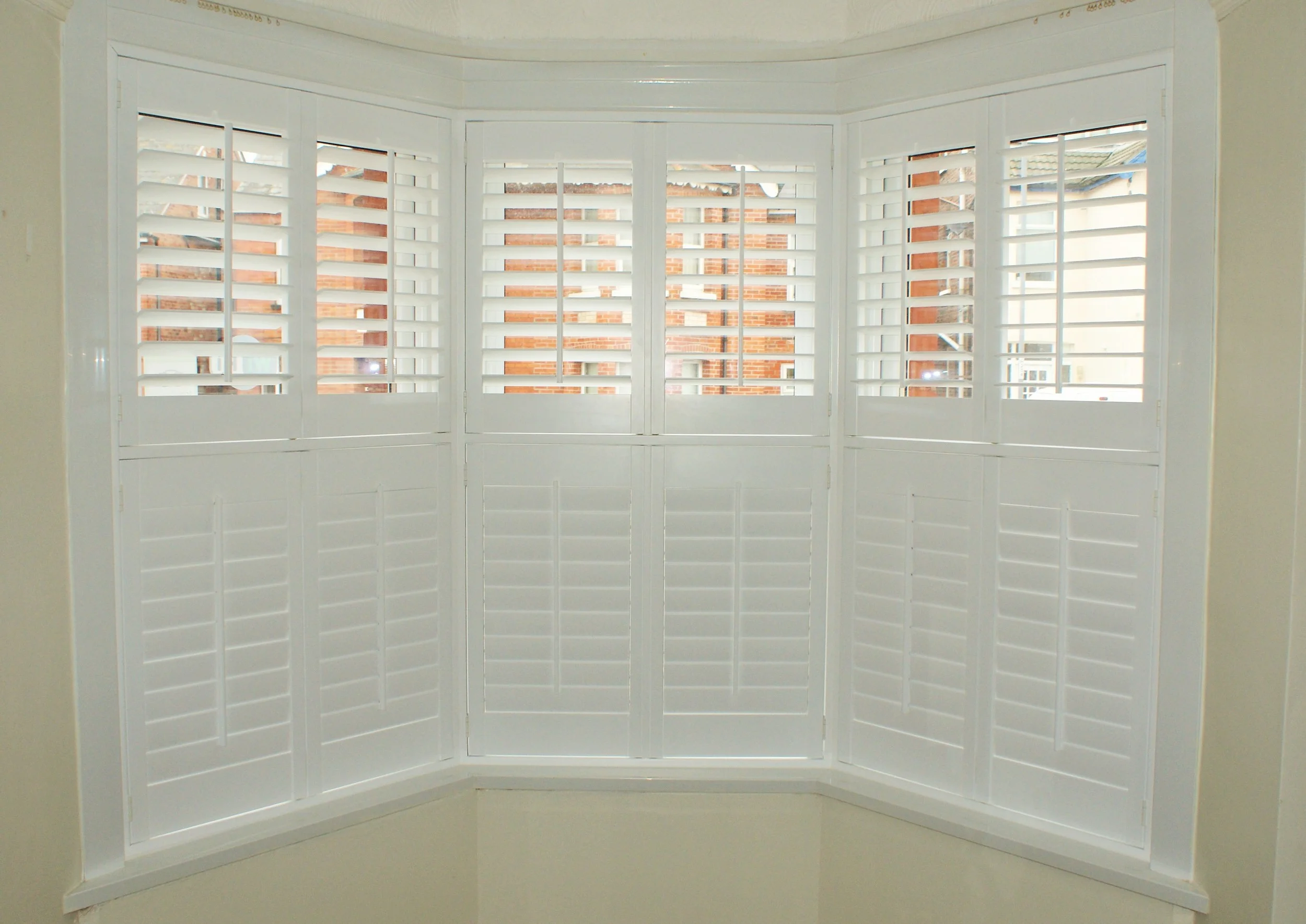 tier-on-tier-bay-window-shutters-in-weymouth-dorset-£1195.JPG