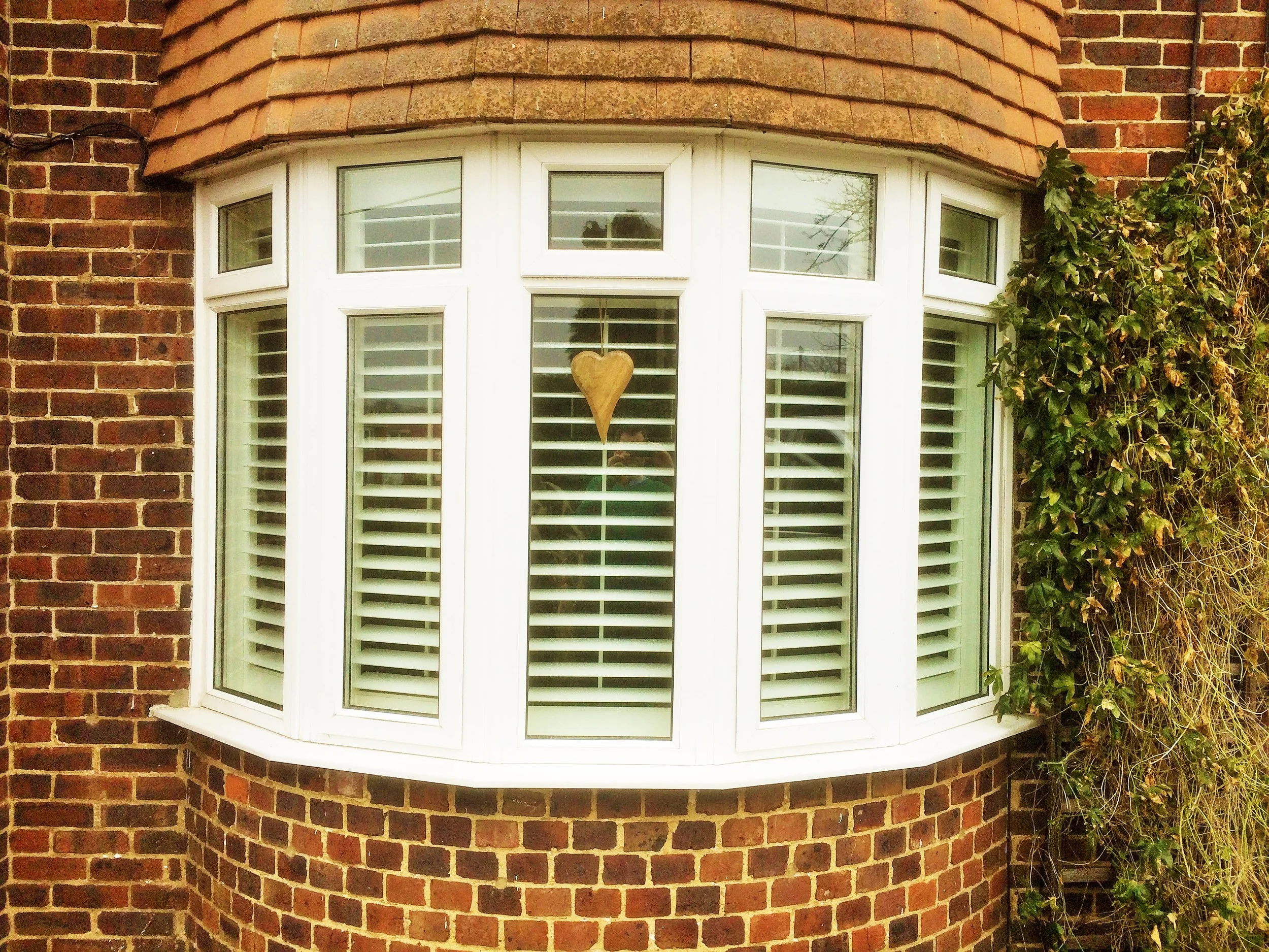 view-from-street-bow-window-with-plantation-shutters-ashvale-aldershot-£873.JPG