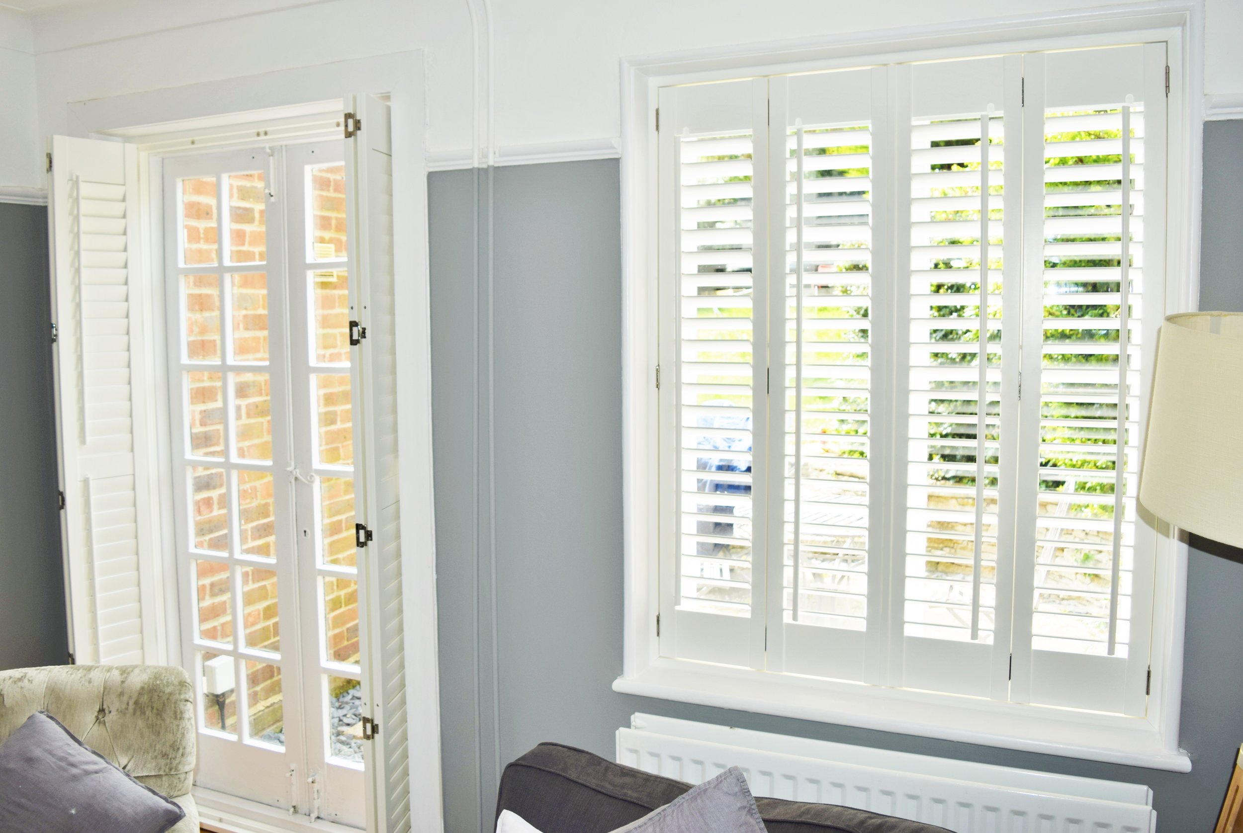 Open patio door shutters with silver hinges