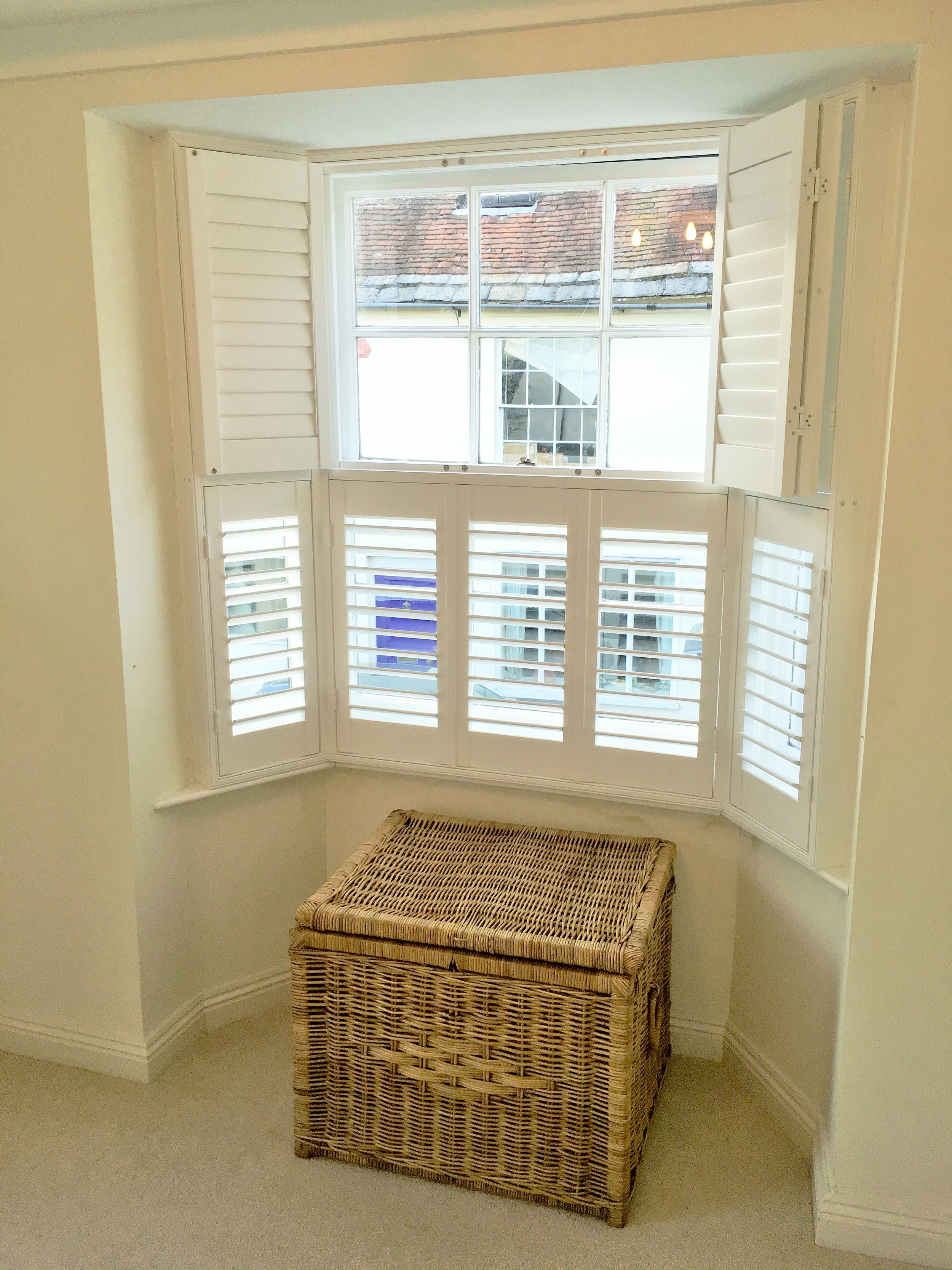 Bay window wooden shutters Blandford Forum.JPG