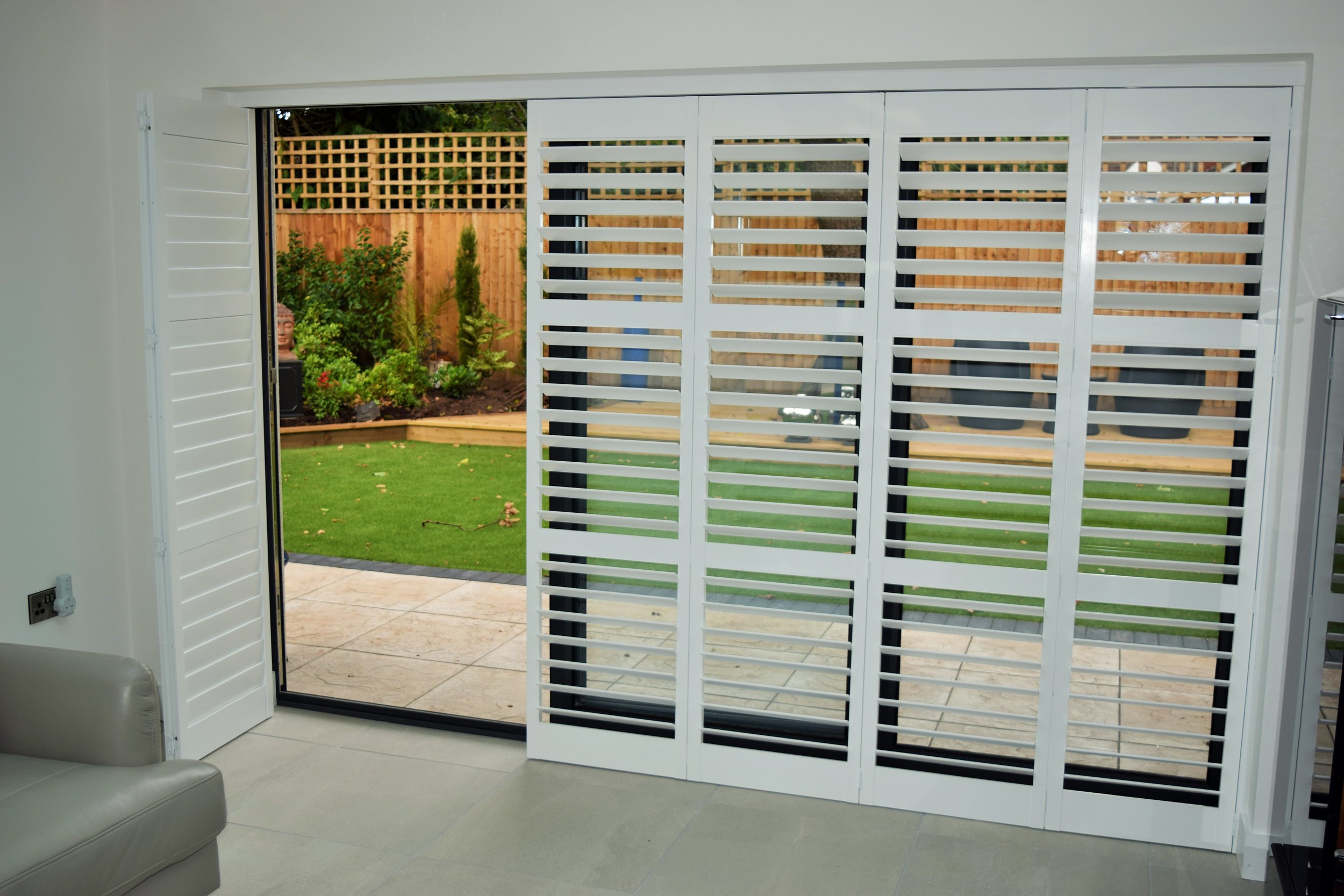 Tracked patio door shutters Verwood