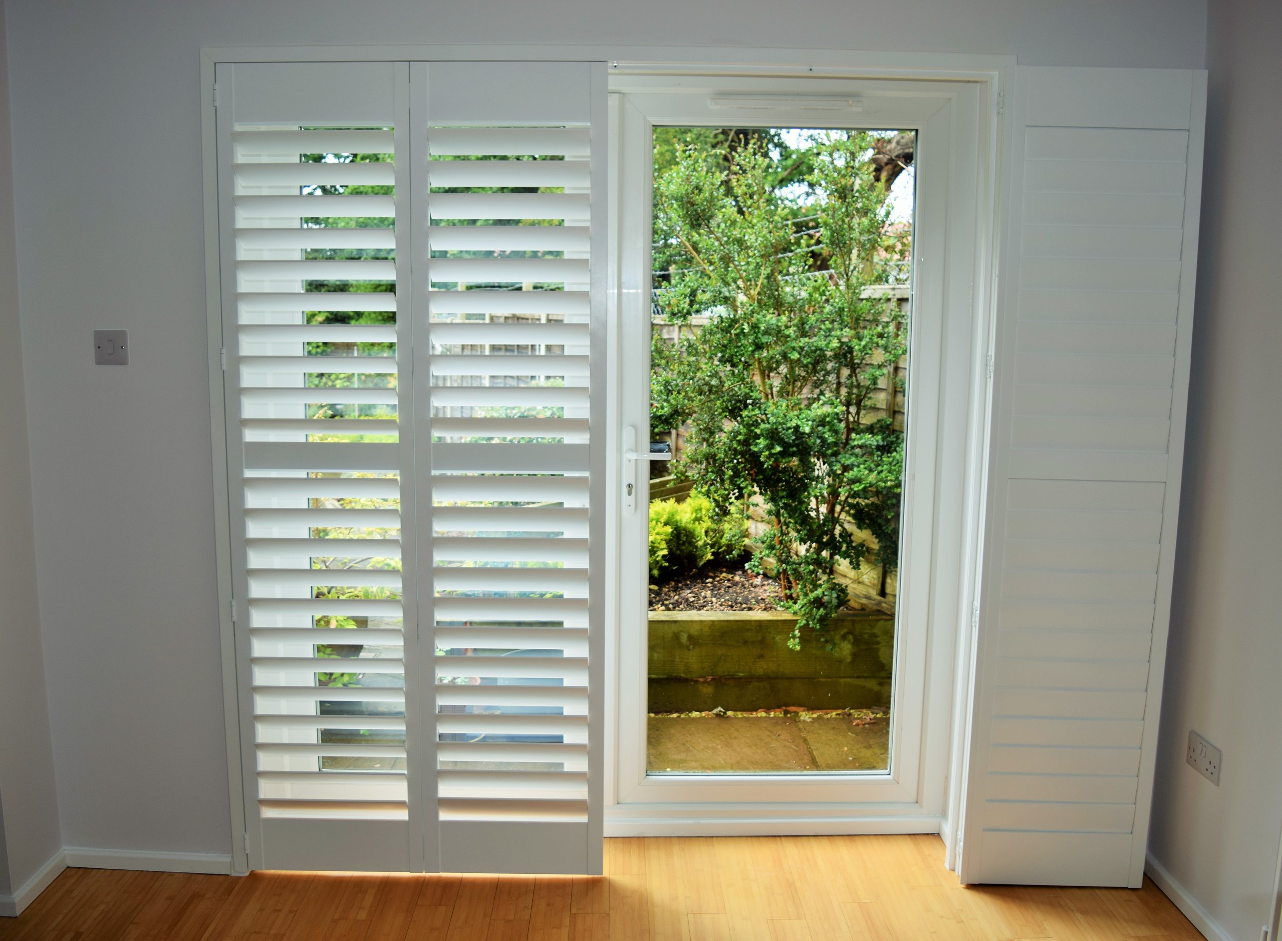 folding Patio door shutters on track.JPG