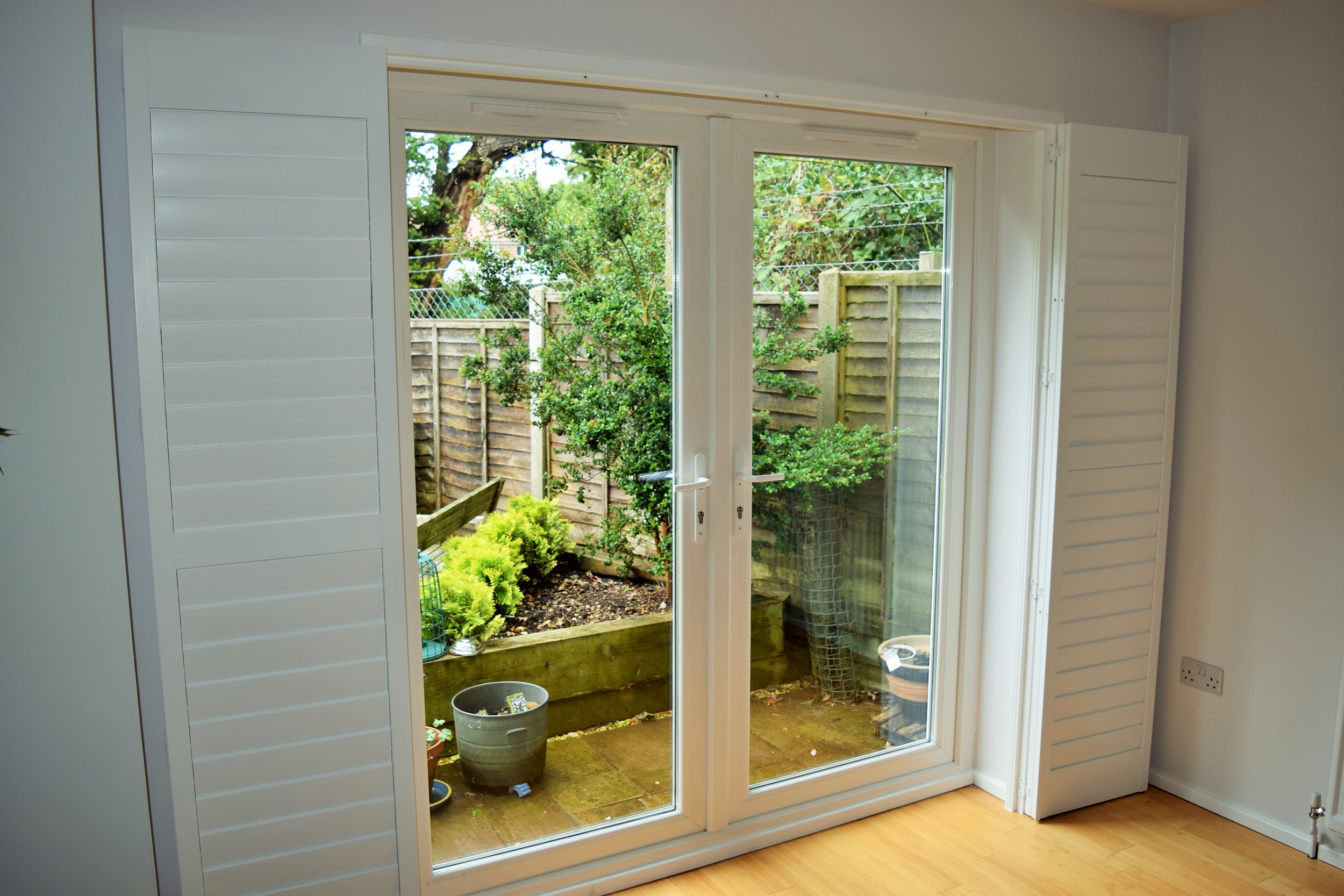 Patio door shutters on track.JPG