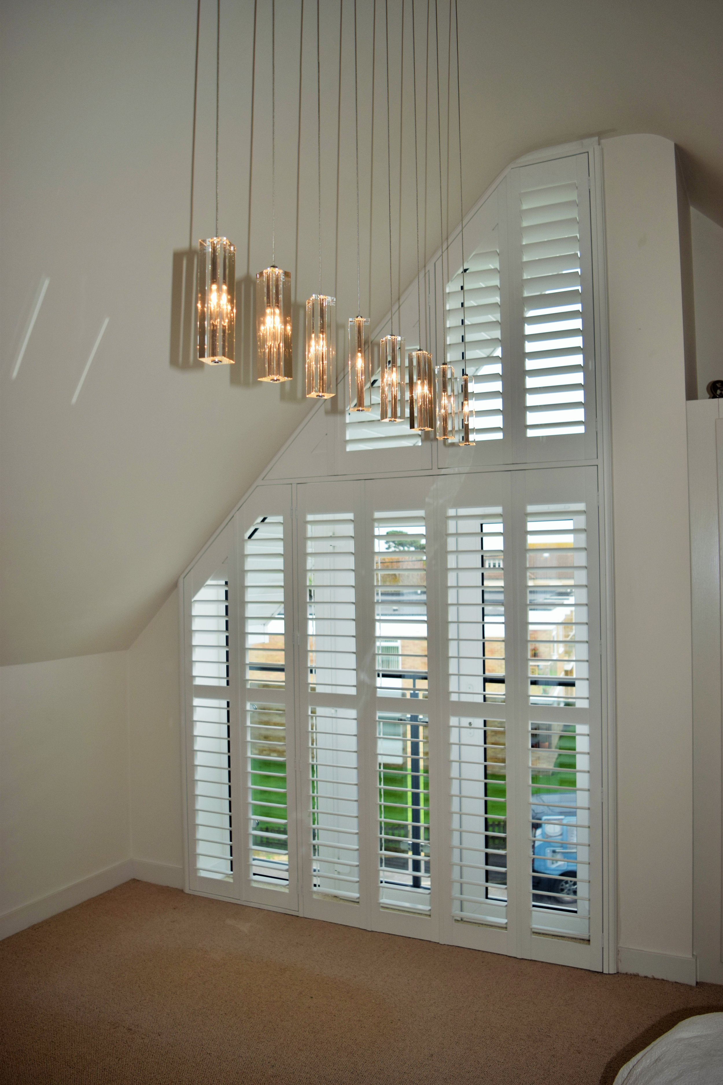 Triangular shape shutters with patio door