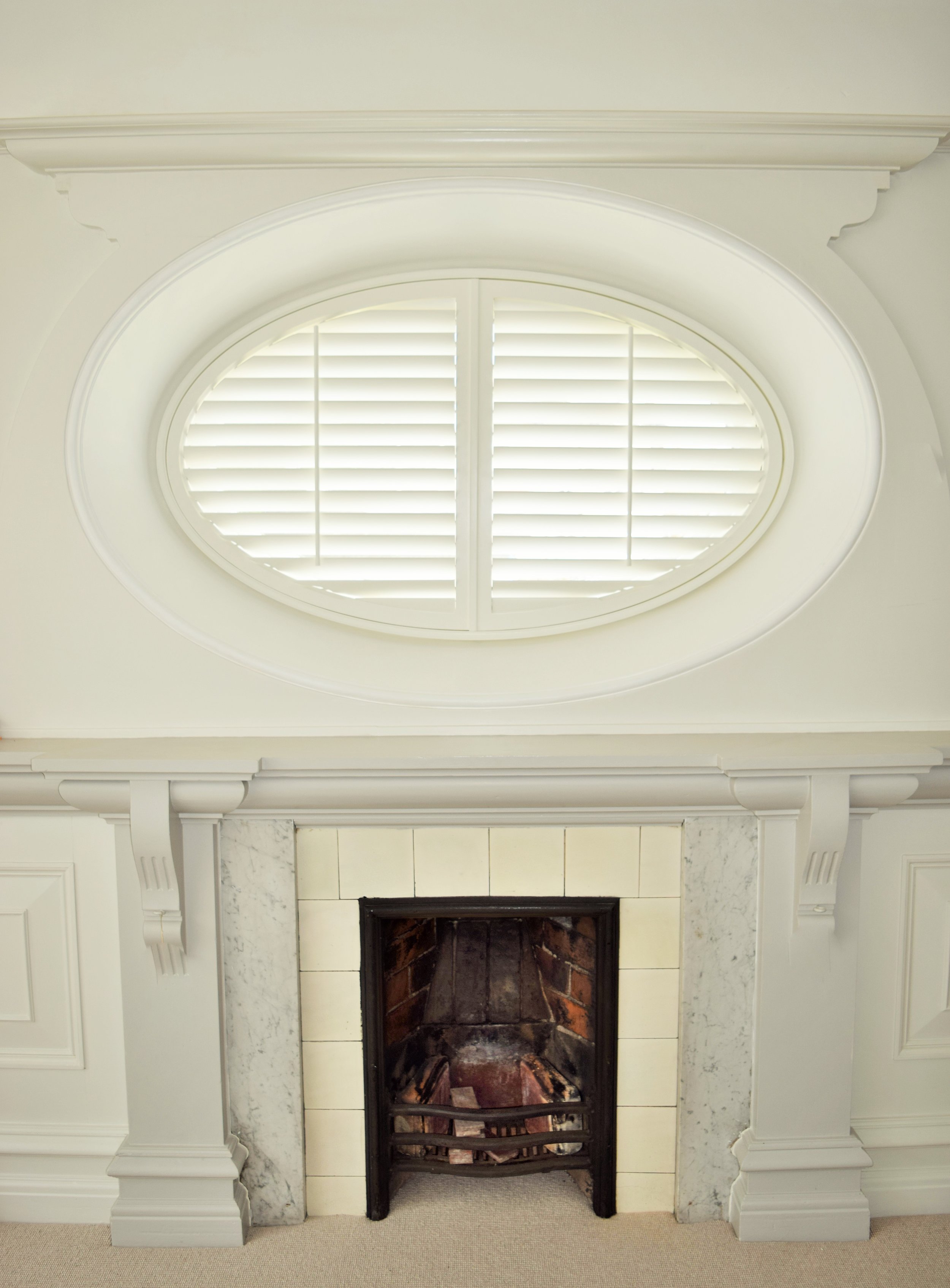 Oval Plantation shutters Dorchester.JPG