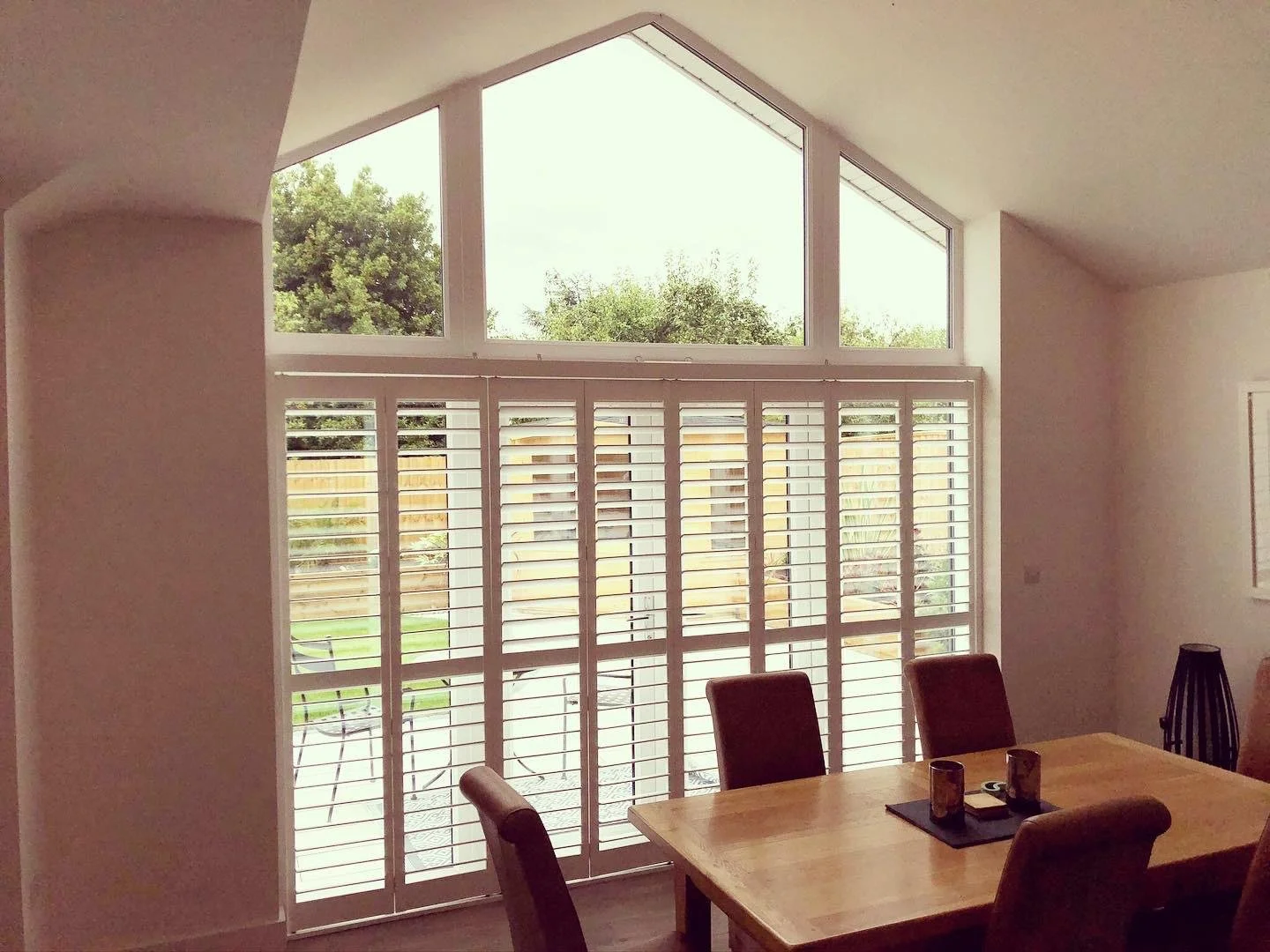 Tracked Shutters to Large Doors under shaped Window.jpg