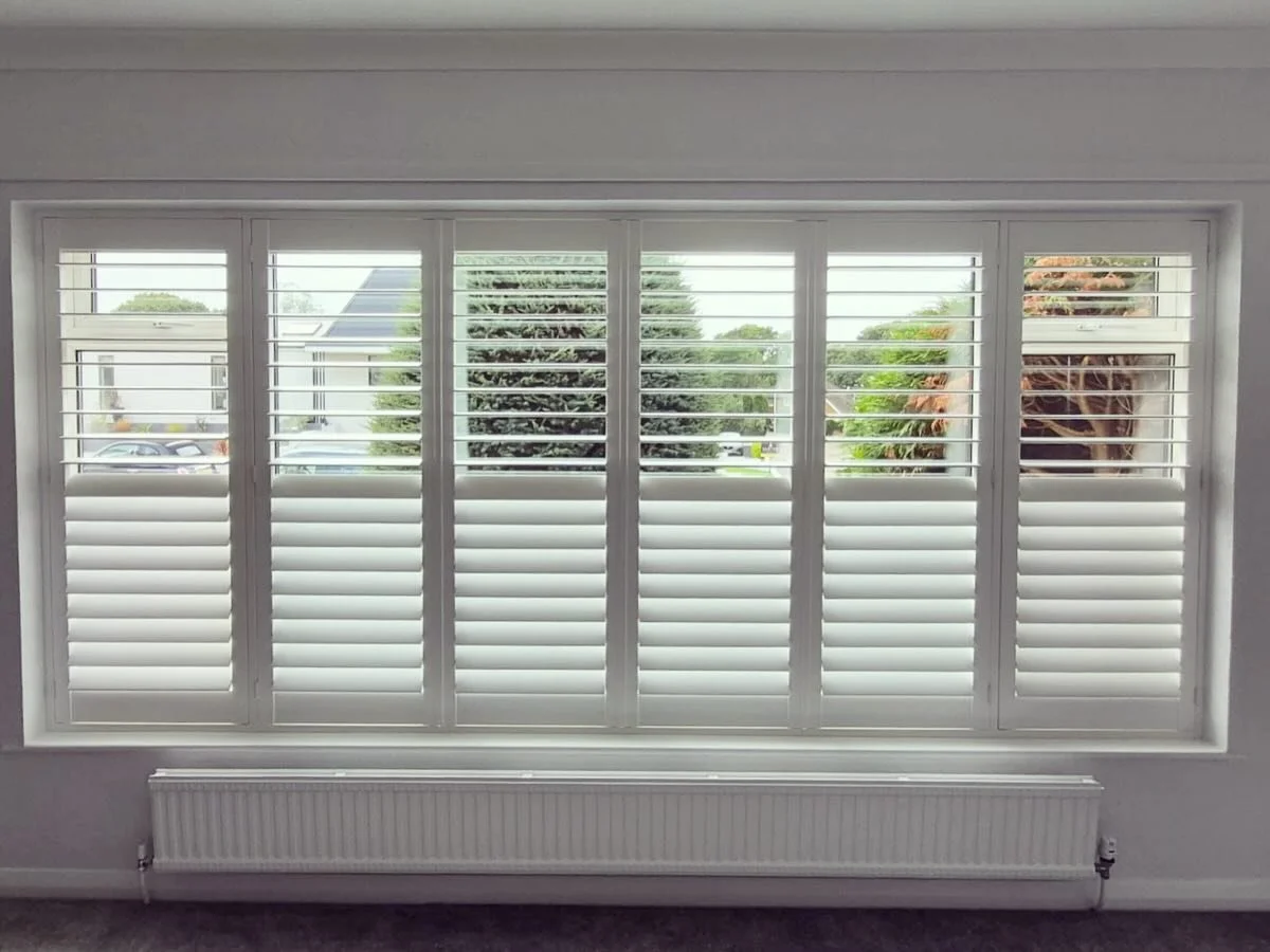 Hardwood shutters installed in Lilliput to this lovely large lounge window.
89mm louvres in pure white with a 50/50 louvre split.
#plantationshutters #windowshutters #bespokeshutters #madetomeasure #shutters #shutterblinds #whiteshutters #interiorsh