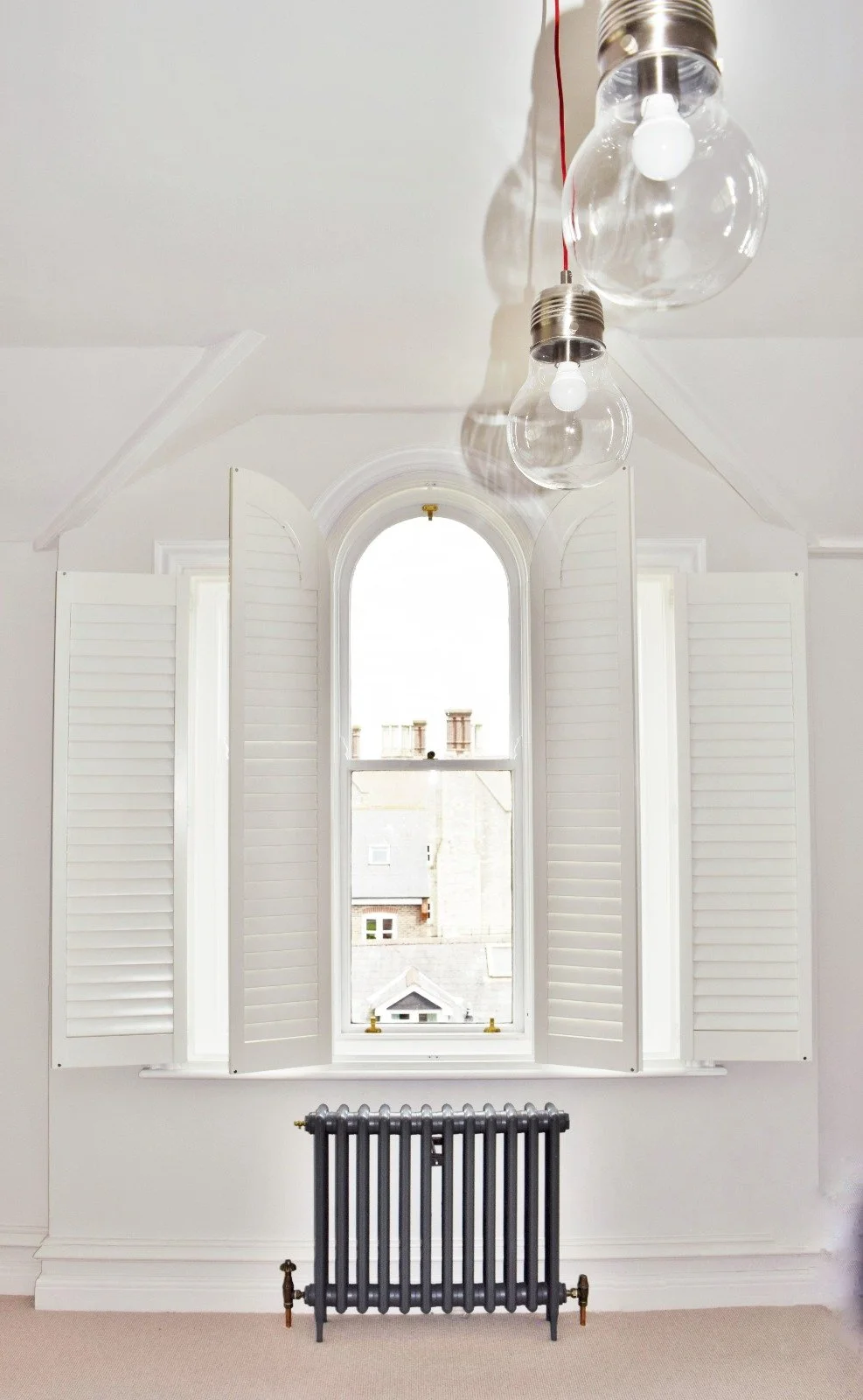 Arch Shaped Shutter Installation.jpeg