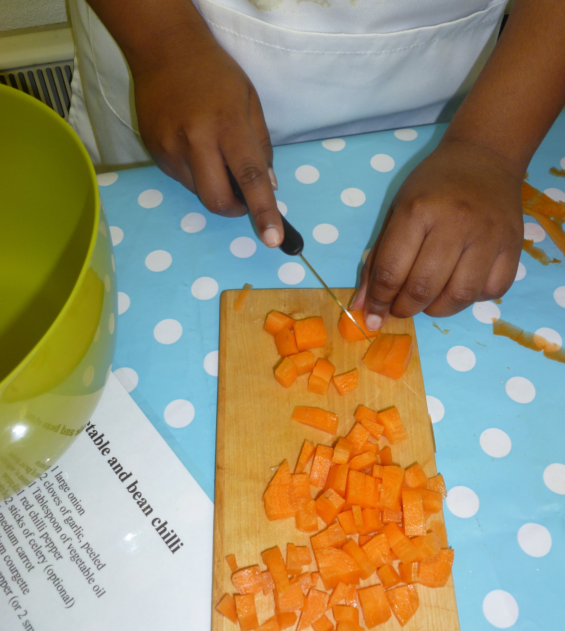 Chopping vegetables at St Michael on the Mount School for a vegetable and bean chilli