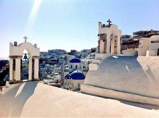 The famous blue dome churches in Oia Santorini