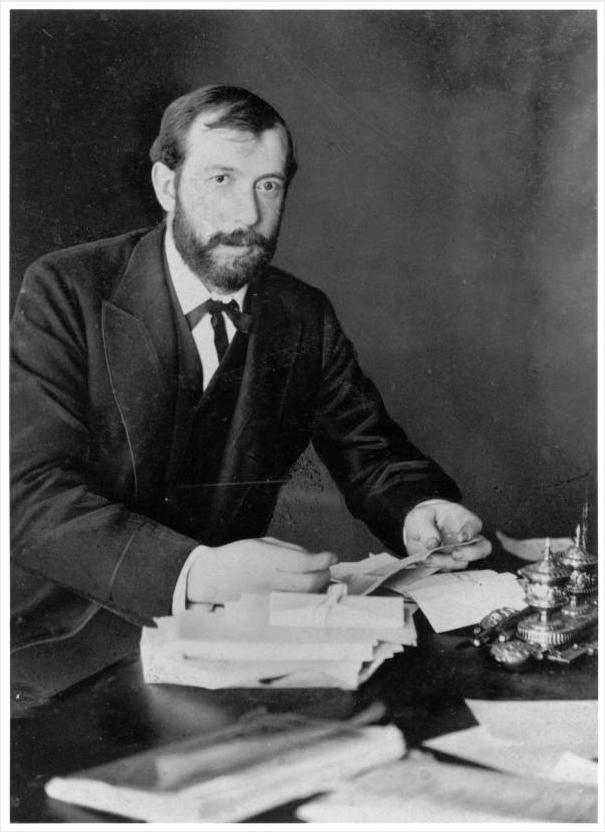 Scripps poses at his desk, ink staining his fingers, circa 1880s. Image source: W. Scripps as young newspaper publisher at desk, 1880s by unknown photographer is from the E.W. Scripps Papers at the Ohio University Libraries and is in the public domain.