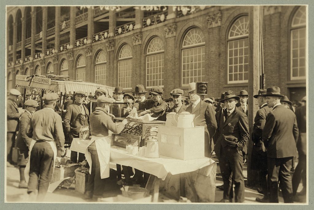 Baseball fans--"Hot dogs" for fans waiting for gates to open at Ebbets Field, Oct. 6, 1920. Image source: Library of Congress, Prints & Photographs Division, LC-DIG-ppmsca-18463 from the George Grantham Bain (1865–1944) collection has no known copyright restrictions