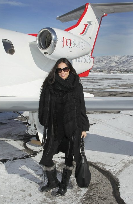 Demi Moore arrives at the Sundance Film Festival wearing a Celine Cannon Scarf.
