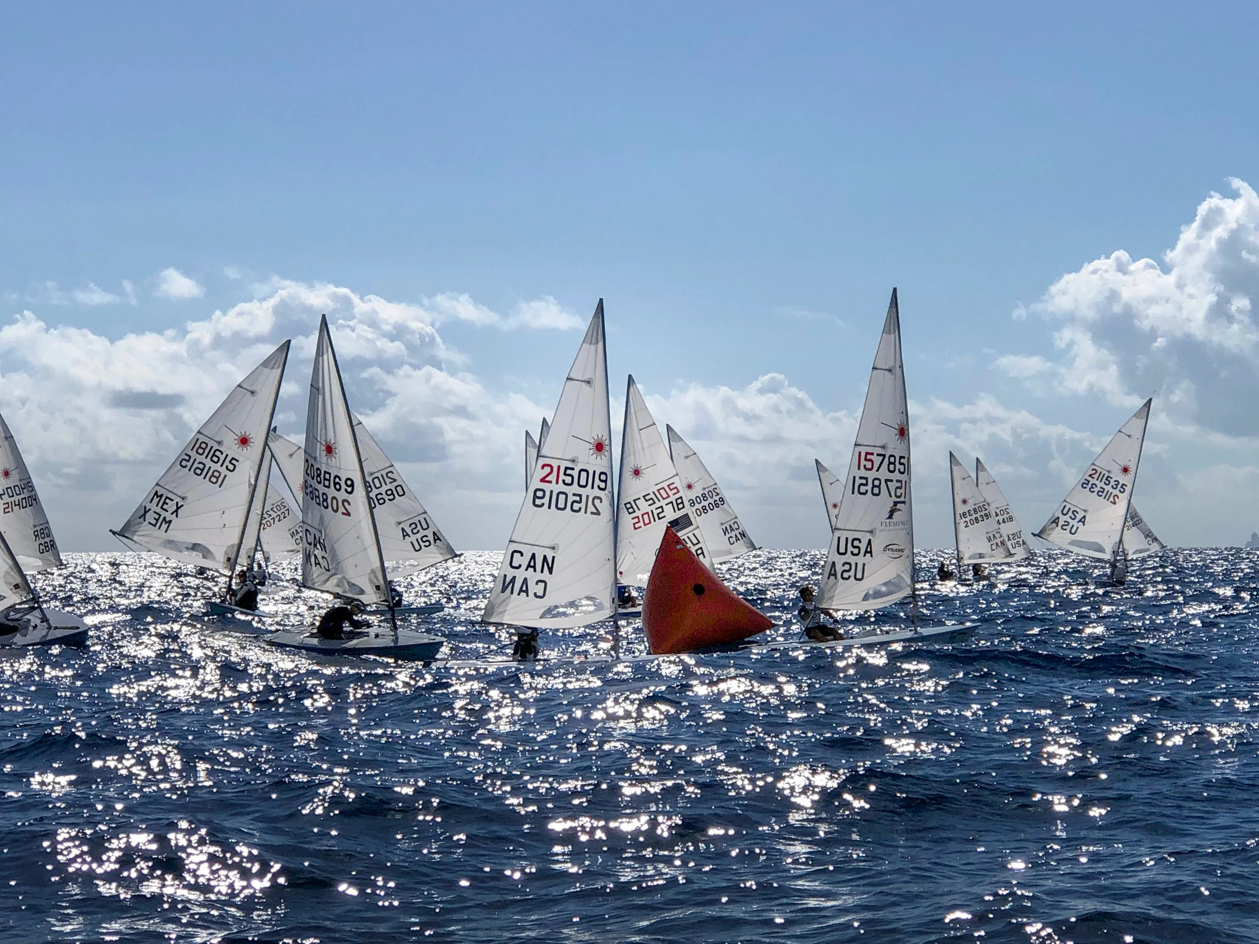 Leeward mark rounding (new sail number 215019) with fellow Canadian and 2016 Canadian Olympian Lee Parkhill (sail number 208869). Photo Credit: Coach Chris Cowan