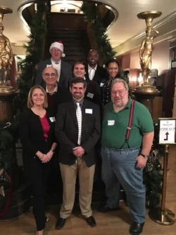 (Left to Right, Front to Back) Shannon Bailey, Karl Weis, Harald Mallwitz, Chuck Maggio, Brandon Harris, Ruby Wilson, Daniel Forbes, & Paul Harris