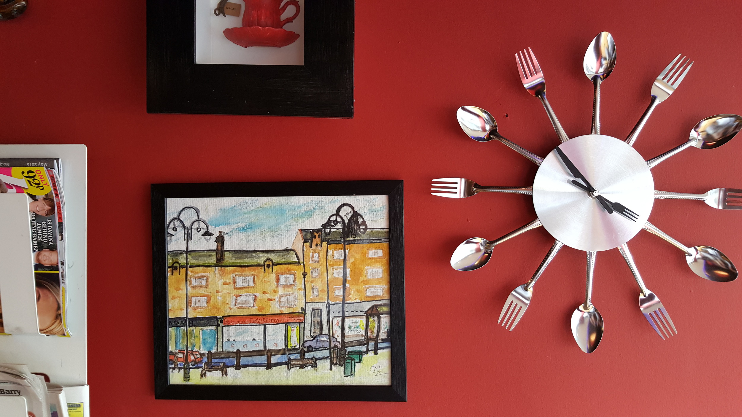 Red painted interior walls to match the old branding; novelty clock (unknown origin).