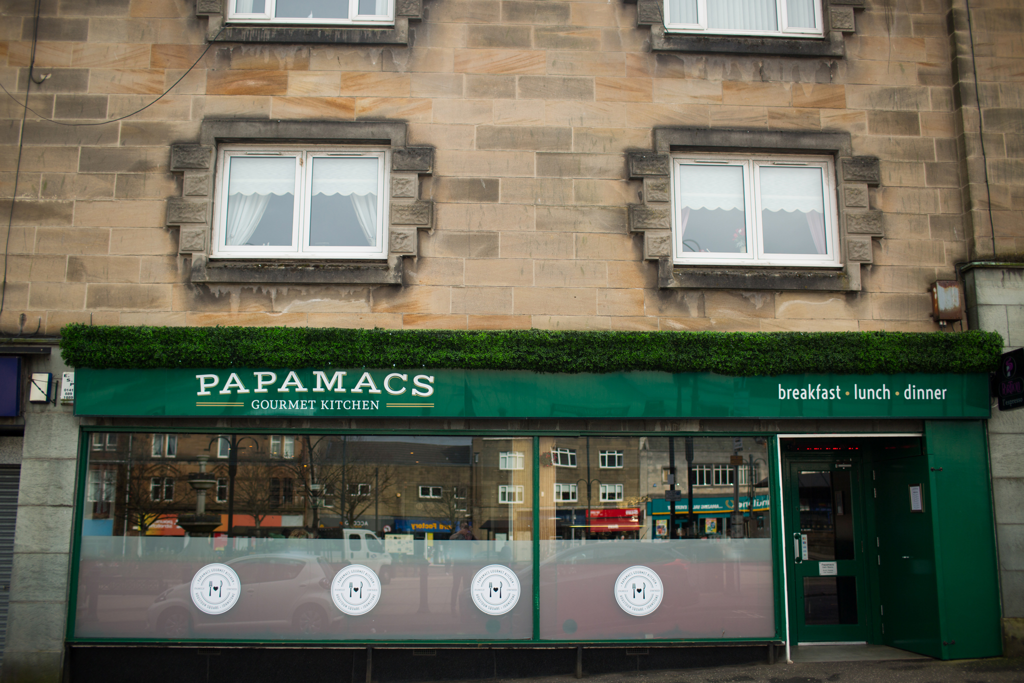 The new Papamacs signage and exterior, announcing the new name (Gourmet Kitchen) to the world. Vinyl badges on the outside covering an unremovable vinyl installation on the interior. 